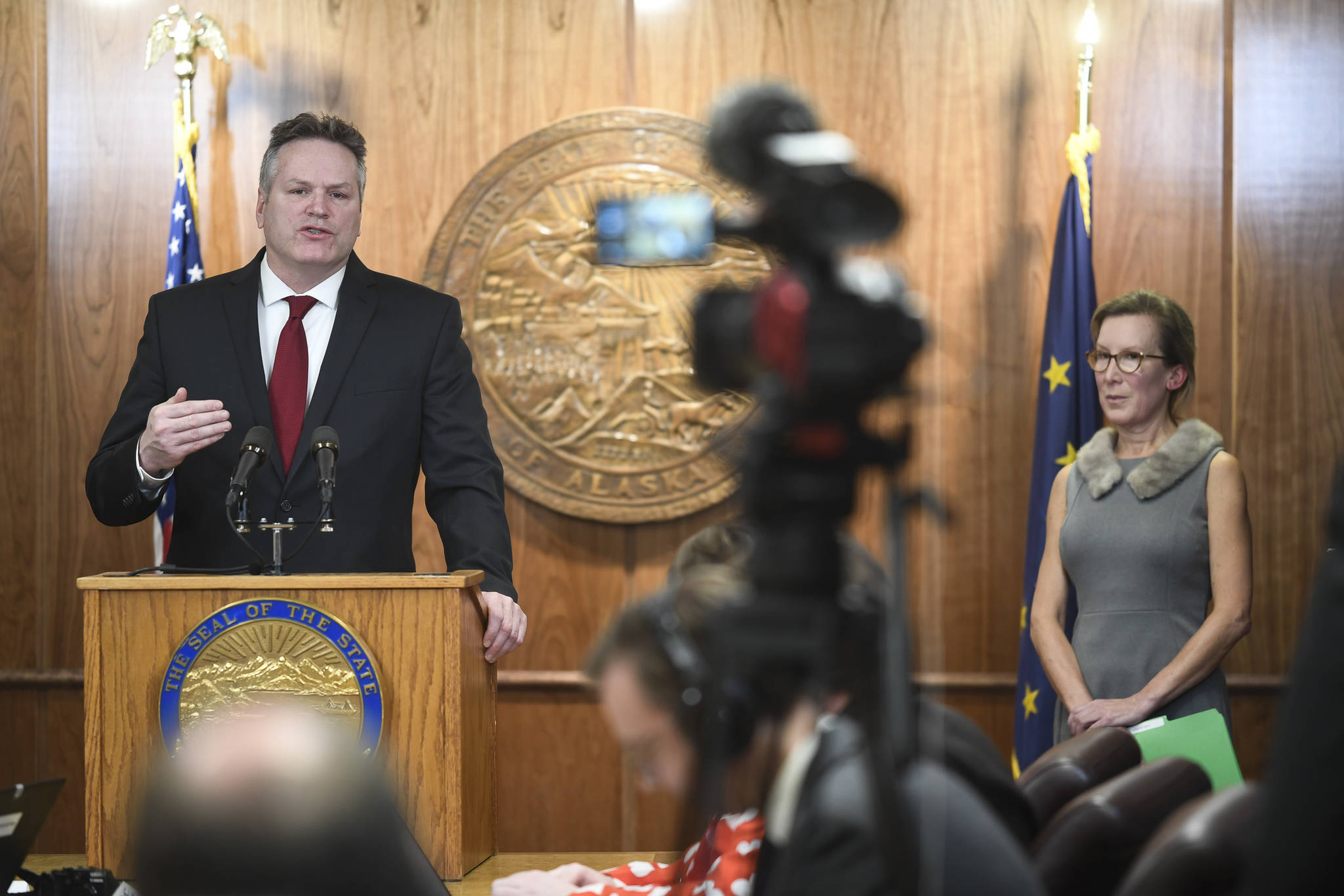Office of Budget and Management Director Donna Arduin, right, listens to Gov. Mike Dunleavy announce his state budget during a press conference on Wednesday, Feb. 13, 2019. (Michael Penn | Juneau Empire)