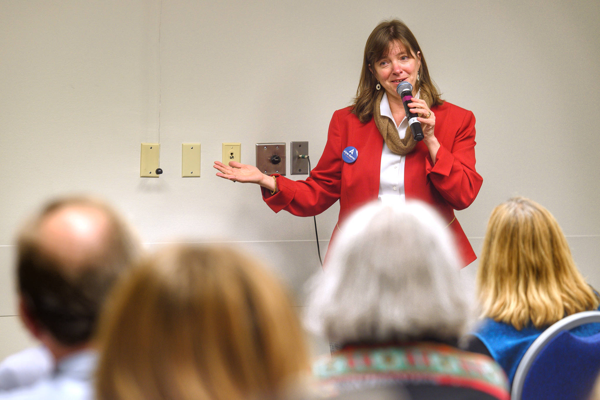 In this Oct. 21, 2018 photo, Alyse Galvin, Alaska’s independent candidate for U.S. House of Representatives, holds a town hall-style meeting to an overflowing room at Centennial Hall. (Michael Penn | Juneau Empire)