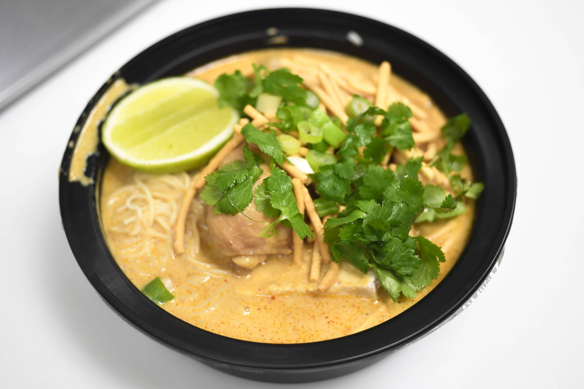 A dish of Khao Soi Gai at Kitchen of Thai Curries on Seward Street on Friday, Feb. 15, 2019. (Michael Penn | Juneau Empire)