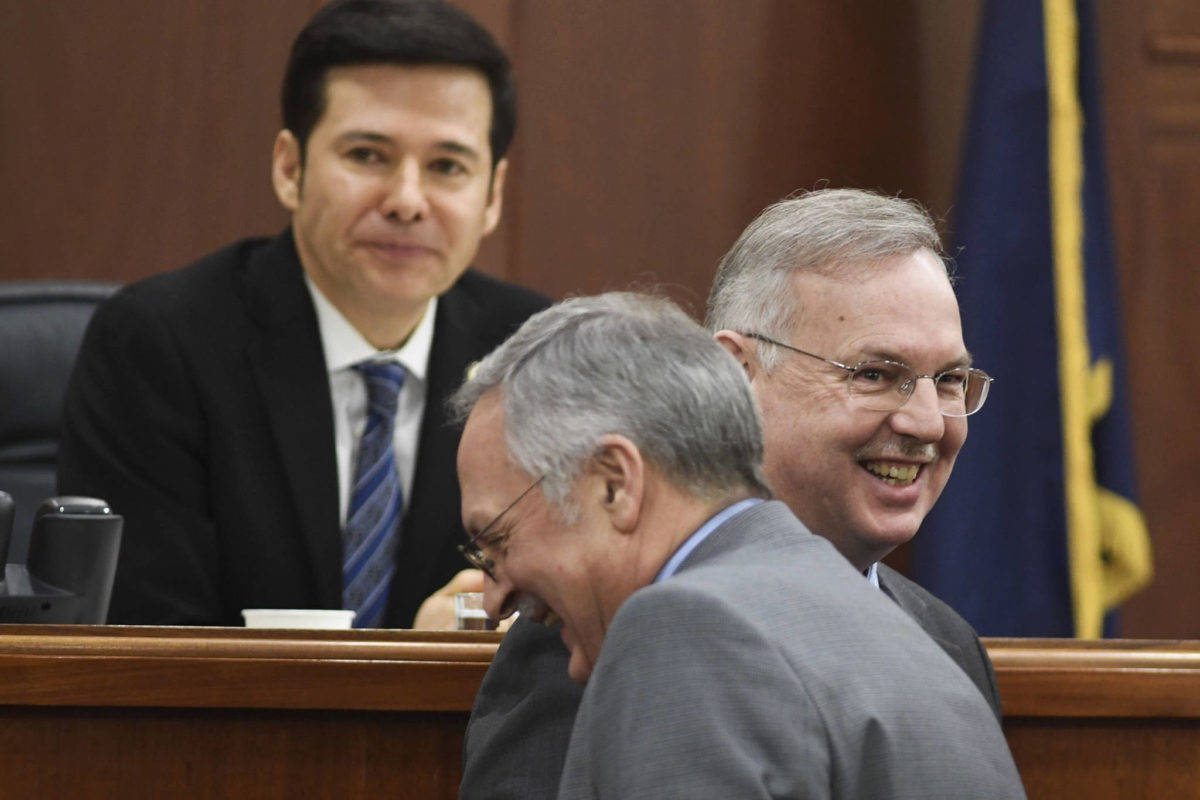 In this Feb. 4, 2019 file photo, former Speaker nominee Rep. Bryce Edgmon, Dillingham, right, shares a laugh with Speaker nominee Rep. David Talerico, R-Healy, as Speaker Pro Tempore Rep. Neal Foster, Nome, presides over the House. Edgmon was elected Speaker of the House on Thursday. (Michael Penn | Juneau Empire)