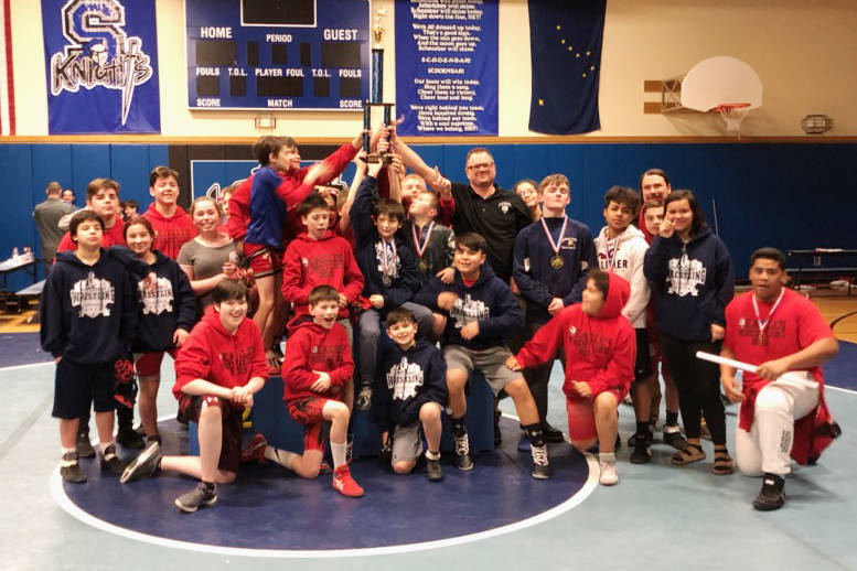 The Floyd Dryden Middle School wrestling team celebrates its Southeast Tournament championship on Saturday at Schoenbar Middle School in Ketchikan. (Courtesy Photo | Ken Brown)