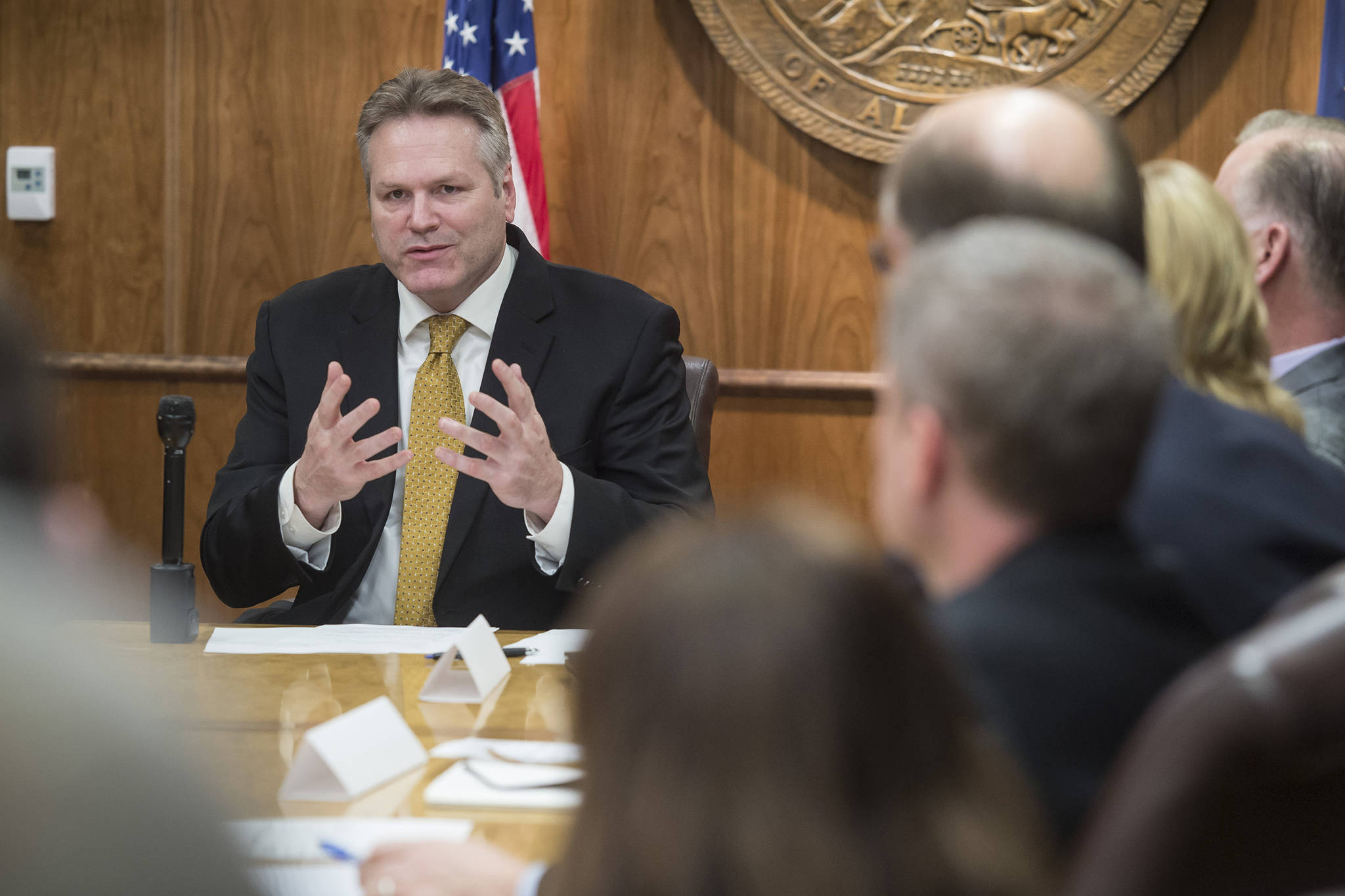 In this Jan. 8, 2019 photo, Gov. Mike Dunleavy meets with his cabinet members and gives attending media a list of his administration’s priorities at the Capitol. (Michael Penn | Juneau Empire)
