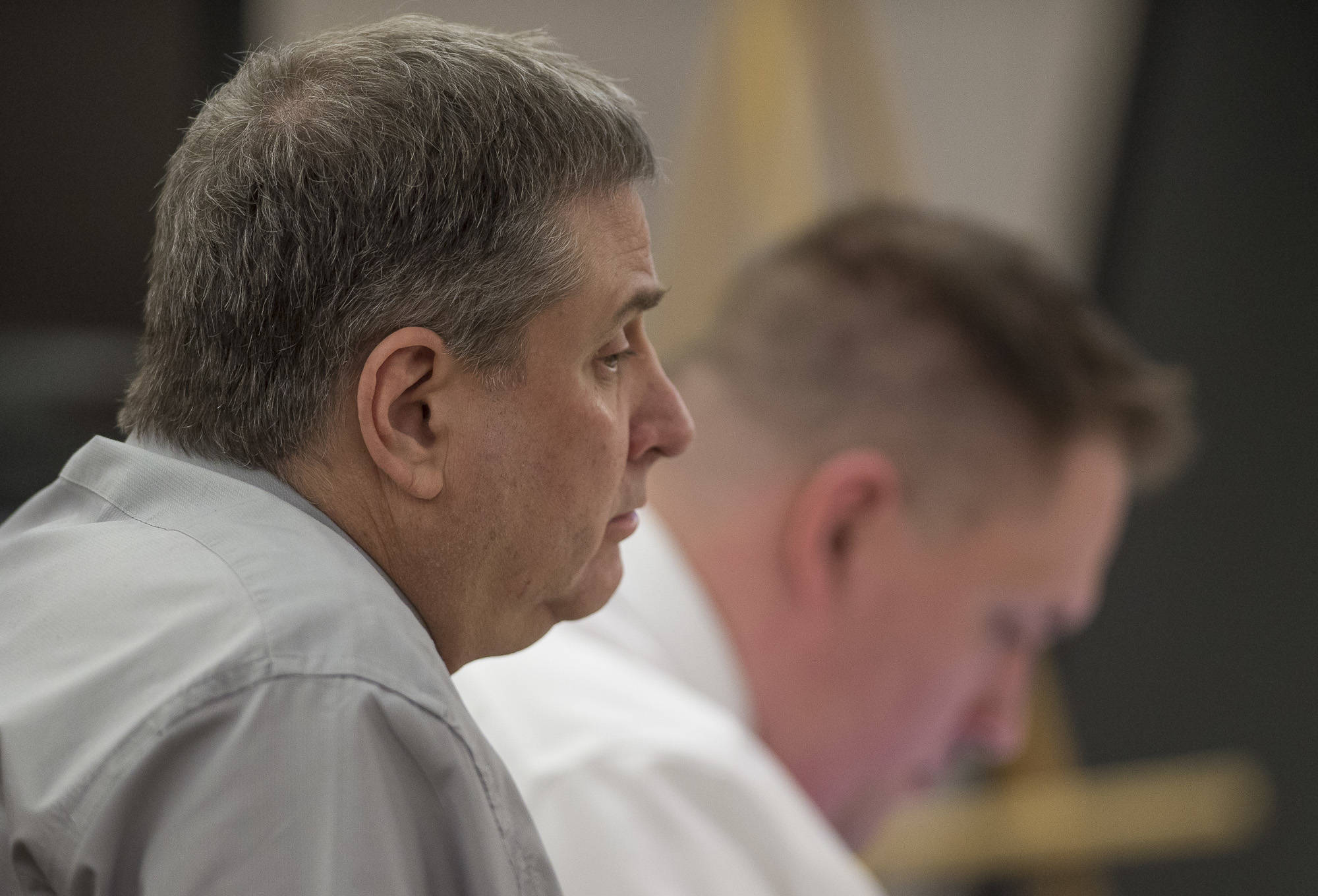 Mark De Simone listens during his trial in Juneau Superior Court on Tuesday, May 1, 2018. De Simone was found guilty of killing Duilio Antonio “Tony” Rosales during a hunting trip in Excursion Inlet in 2016. (Michael Penn | Juneau Empire File)