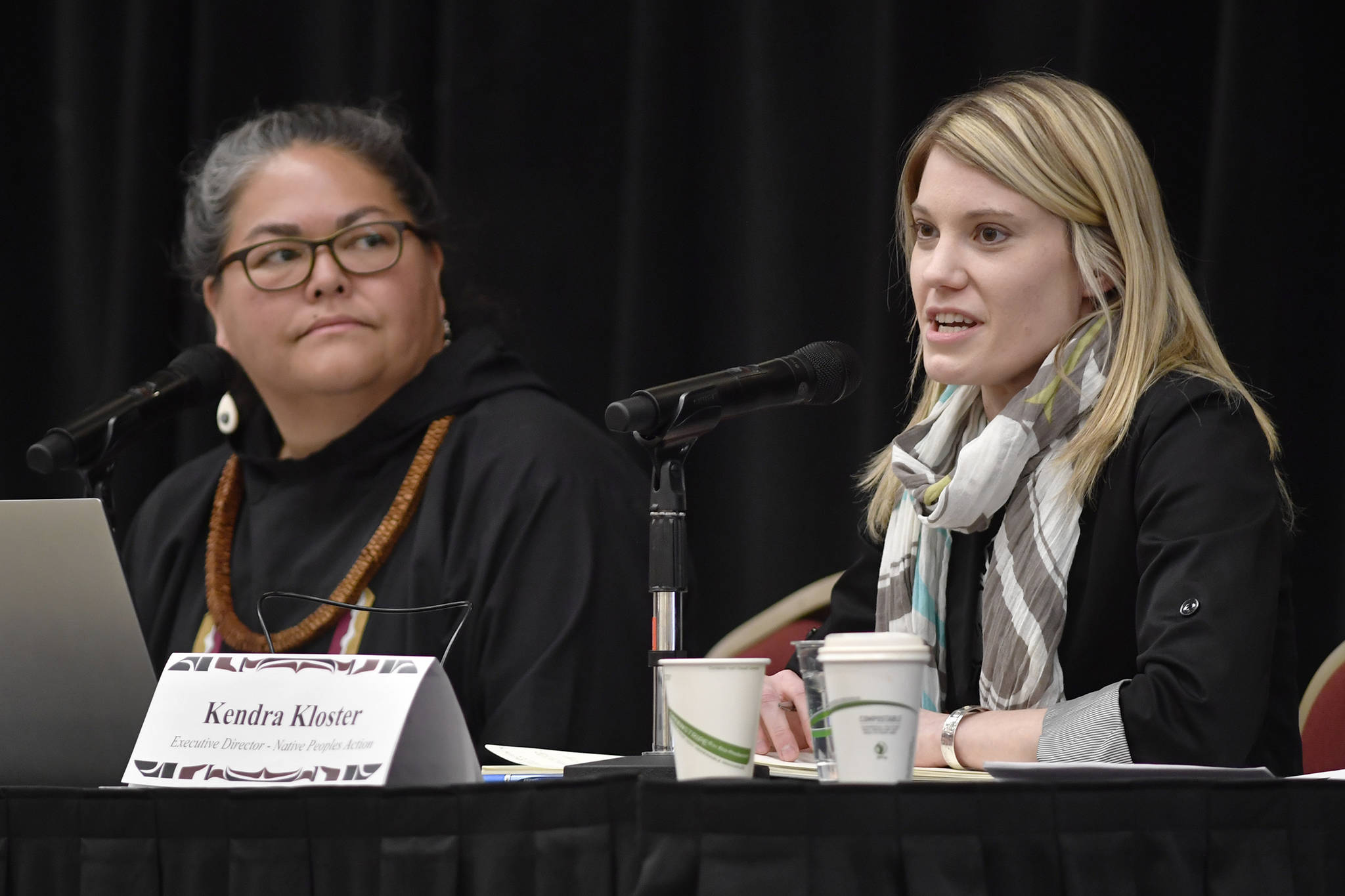 Kendra Kloster, executive director of the Native Poples Action, right, and Liz Medicine Crow, President and CEO of the Alaska Native Policy Center, speak at the Native Issues Forum at Elizabeth Peratrovich Hall on Wednesday, Feb. 20, 2019. (Michael Penn | Juneau Empire)
