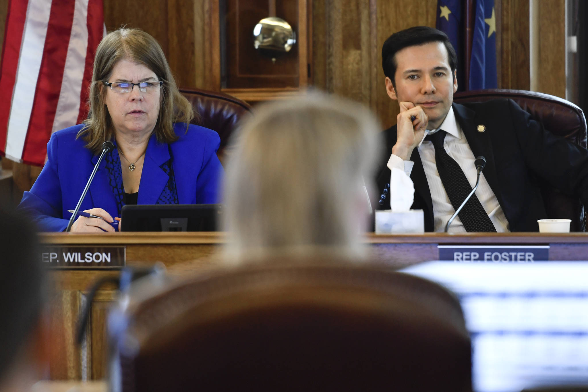 Co-Chairs of the House Finance Committee Rep. Tammie Wilson, R-North Pole, left, and Rep. Neal Foster, D-Nome, listen to Donna Arduin, Director of the Office of Management and Budget, as they hold their first meeting of the session at the Capitol on Thursday, Feb. 21, 2019. (Michael Penn | Juneau Empire)