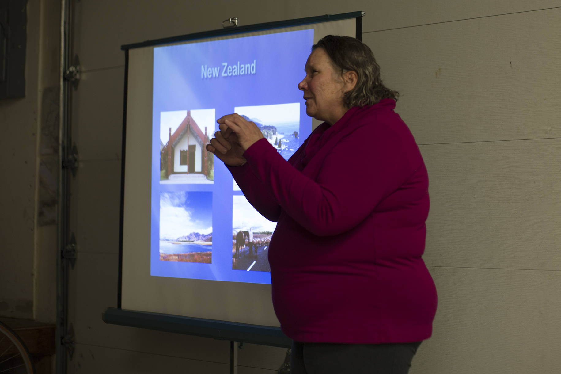 Carole Bookless gives her Adventure Series talk at Cycle Alaska on Thursday night. (Nolin Ainsworth | Juneau Empire)