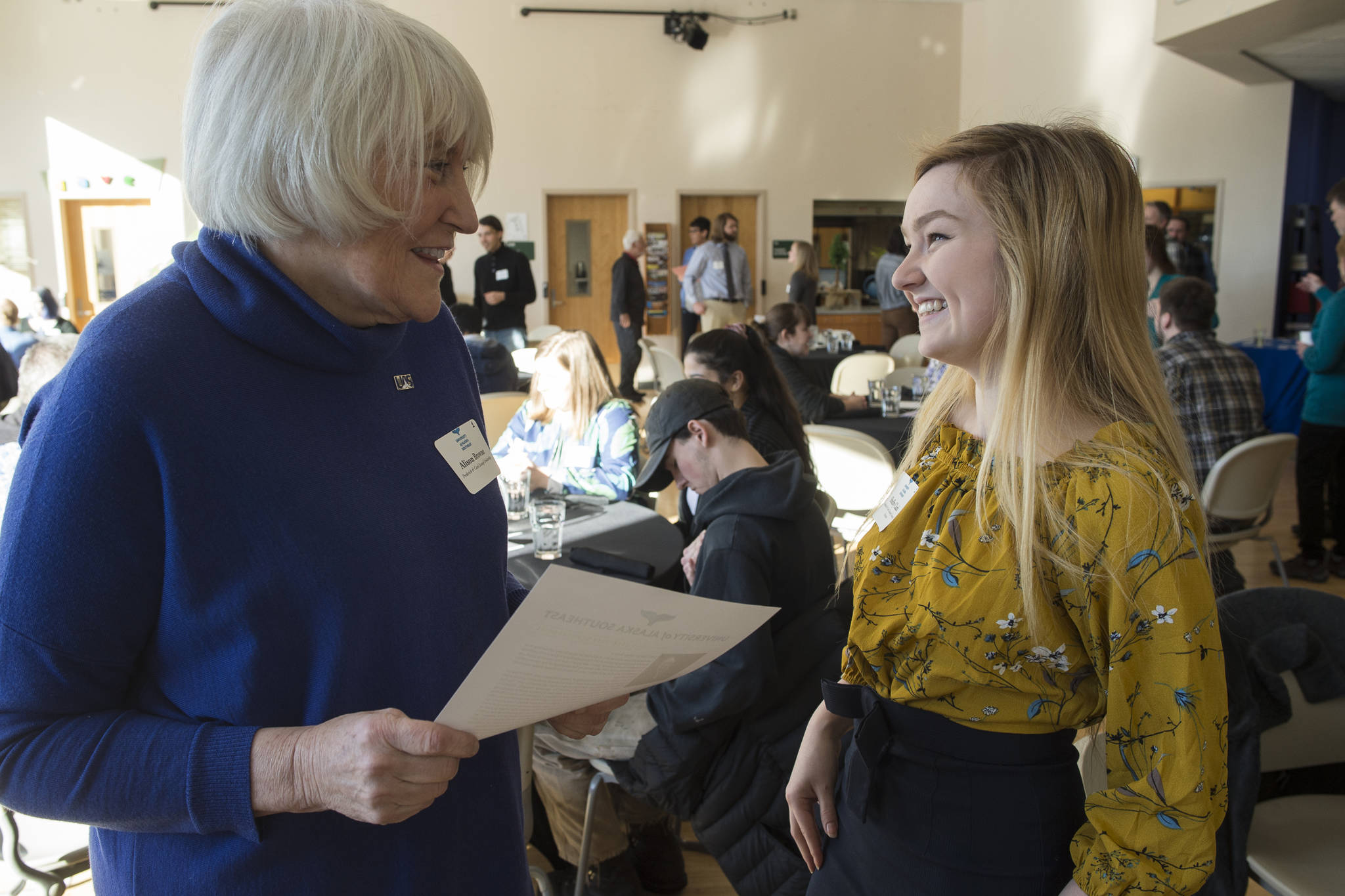 University of Alaska Southeast sophomore Shelby Clark, right, talks with Alison Browne during a scholarship recognition luncheon for 21 student scholarship recipients and their donors at the UAS Rec Center on Friday, Feb. 22, 2019. Clark, a Geography major with an emphasis in Environmental Studies, is the recipient of the Frederick and Carl Eastaugh Scholarship named after Browne’s parents. Corporate and individual donors have contributed more than $300,000 in scholarships to UAS students just this last academic year. (Michael Penn | Juneau Empire)