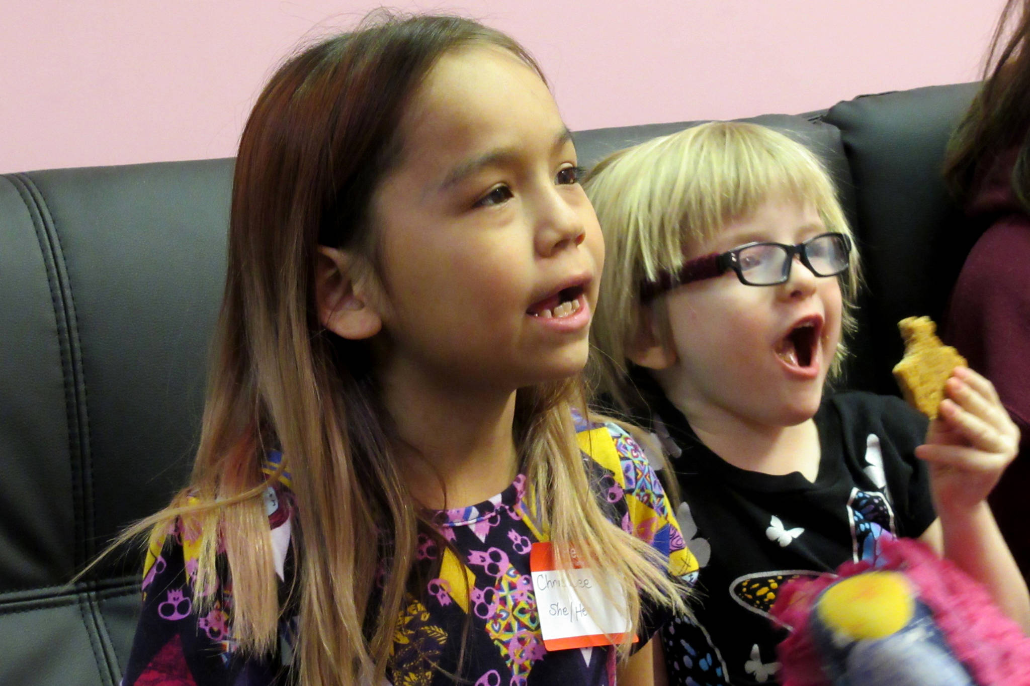 ChrisDee Scharen, 7, and Linden Harris, 4, react while playing video games at Game On’s first Trans Gaming Night, Saturday, Feb. 23, 2019. (Ben Hohenstatt | Capital City Weekly)
