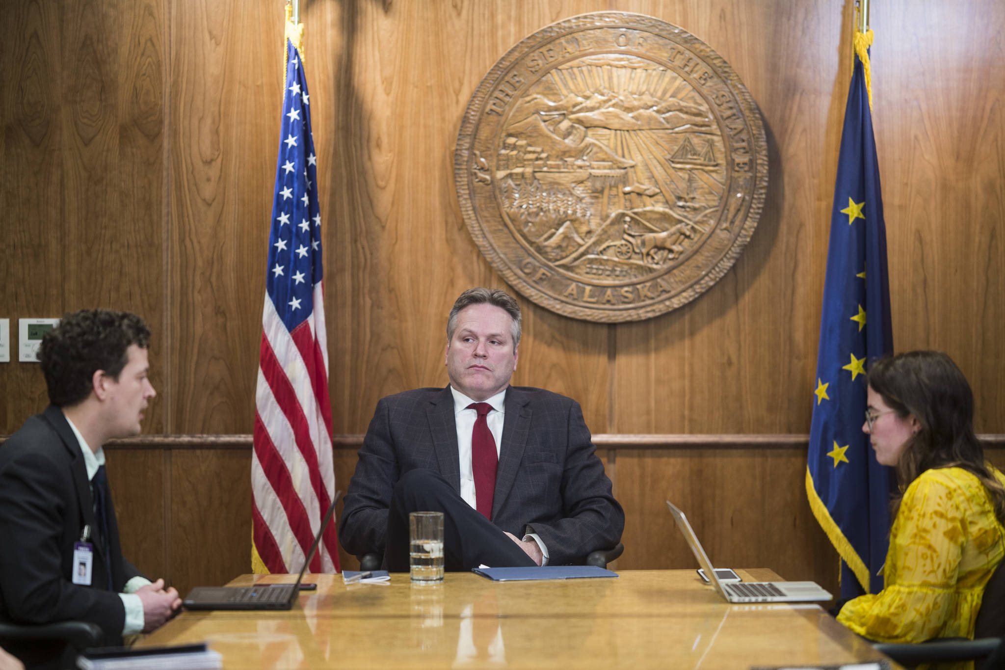 Juneau Empire reporters Kevin Baird, left, and Mollie Barnes interview Gov. Mike Dunleavy at the Capitol on Tuesday, Feb. 26, 2019. (Michael Penn | Juneau Empire)
