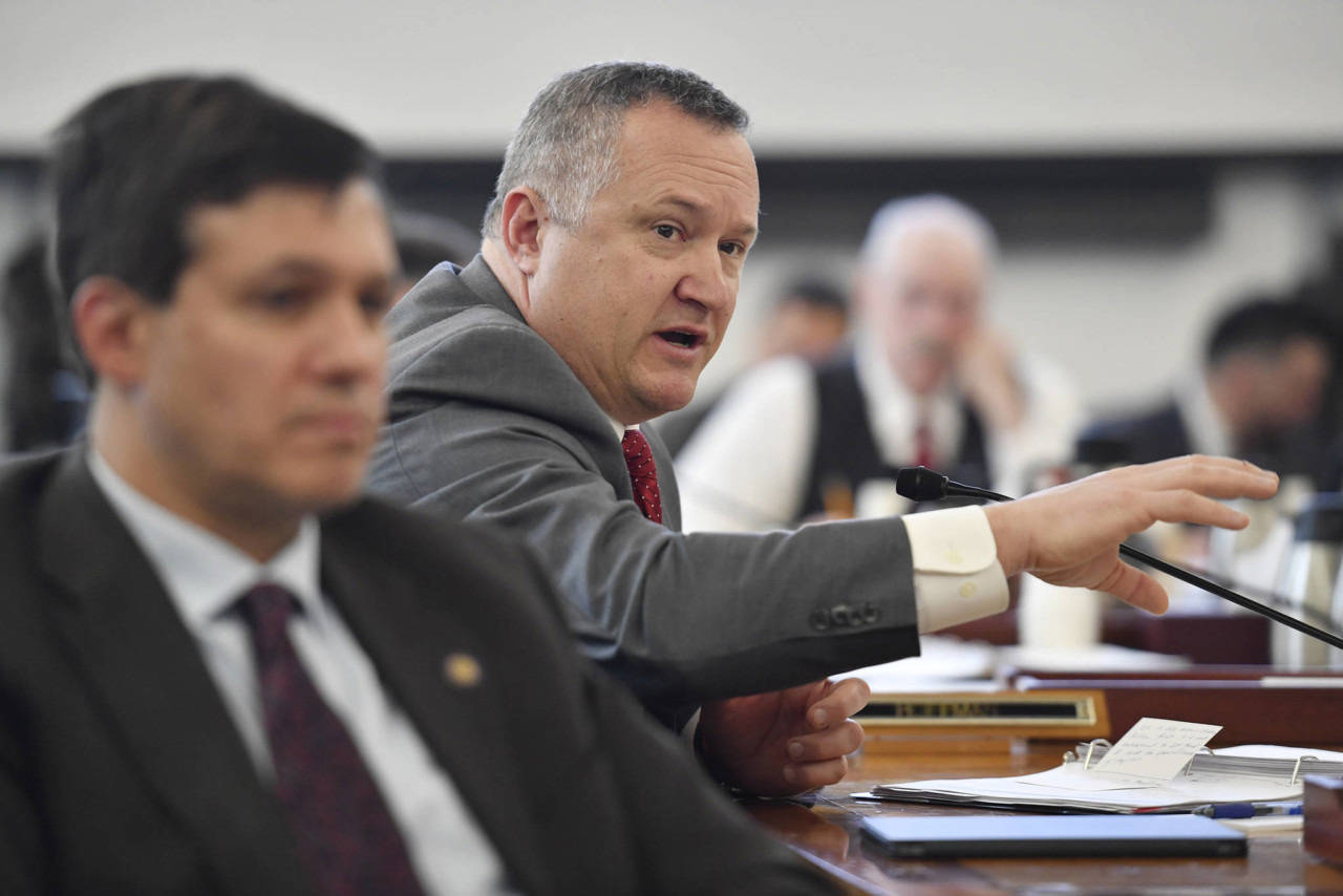 In this file photo, Sen. Mike Shower, R-Wasilla, asks a question as Donna Arduin, Director of the Office of Management and Budget and Mike Barnhill, policy director for the OMB. (Michael Penn | Juneau Empire)