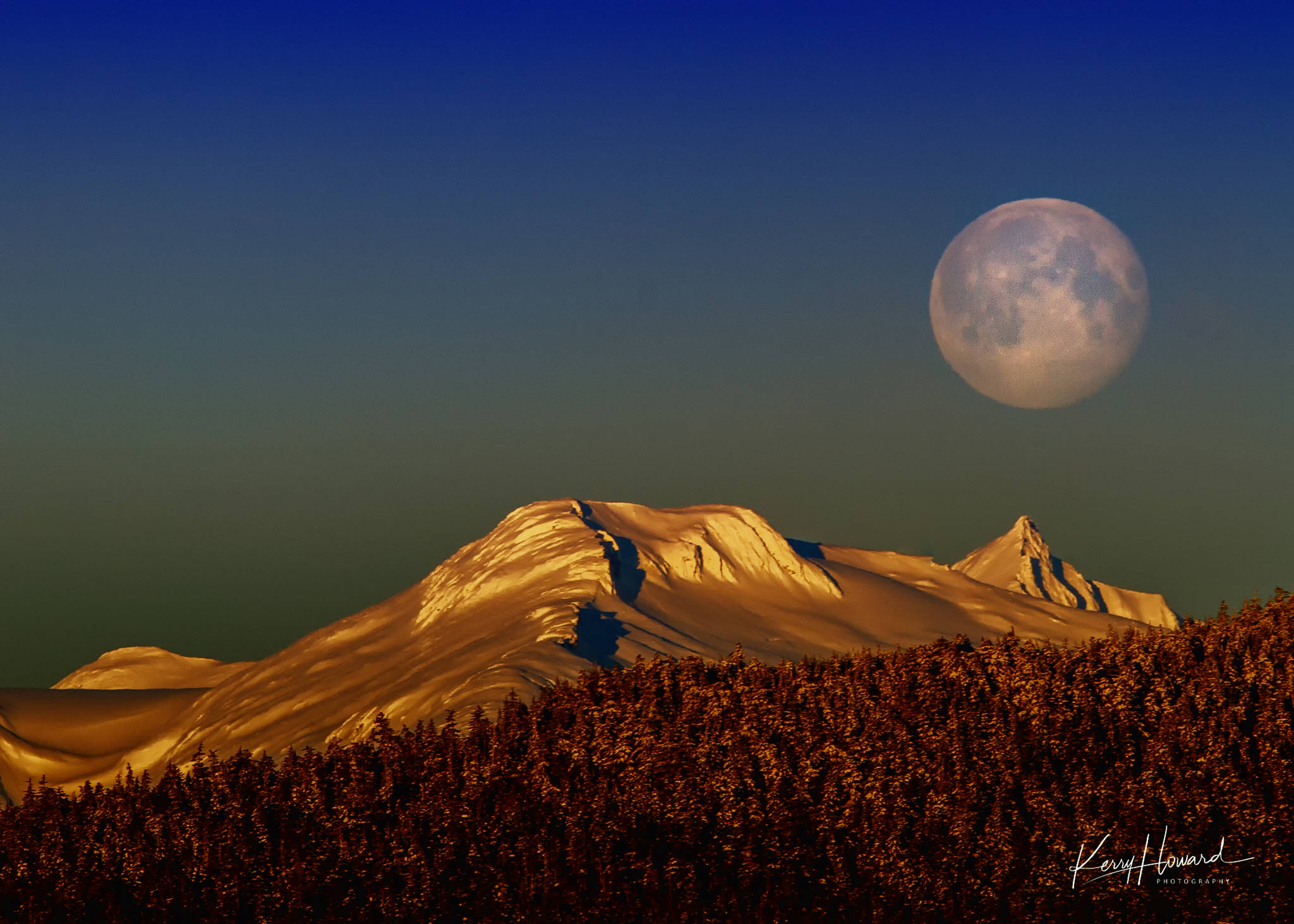 A full moon sets over the Chilkats on Feb. 20, 2019. (Courtesy Photo | Kerry Howard)