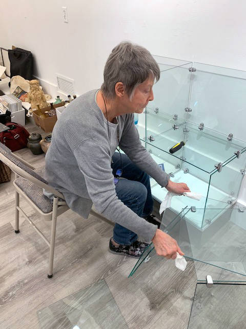 Courtesy Photo | <strong>Juneau Artists Gallery</strong>                                Michelle Morrell works with glass shelves in Juneau Artists Gallery during February before the space’s March 1 grand reopening.