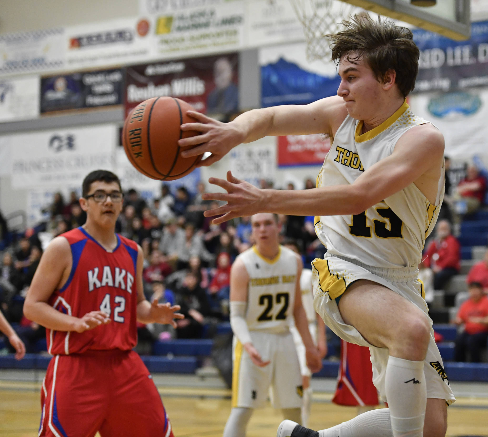 Thorne Bay’s Joseph Vondoloski saves a ball from going out of bounds against Kake in the final of the Region V 1A Basketball Championships at Thunder Mountain High School on Friday, March 1, 2019. Thorne Bay won 55-44. (Michael Penn | Juneau Empire)