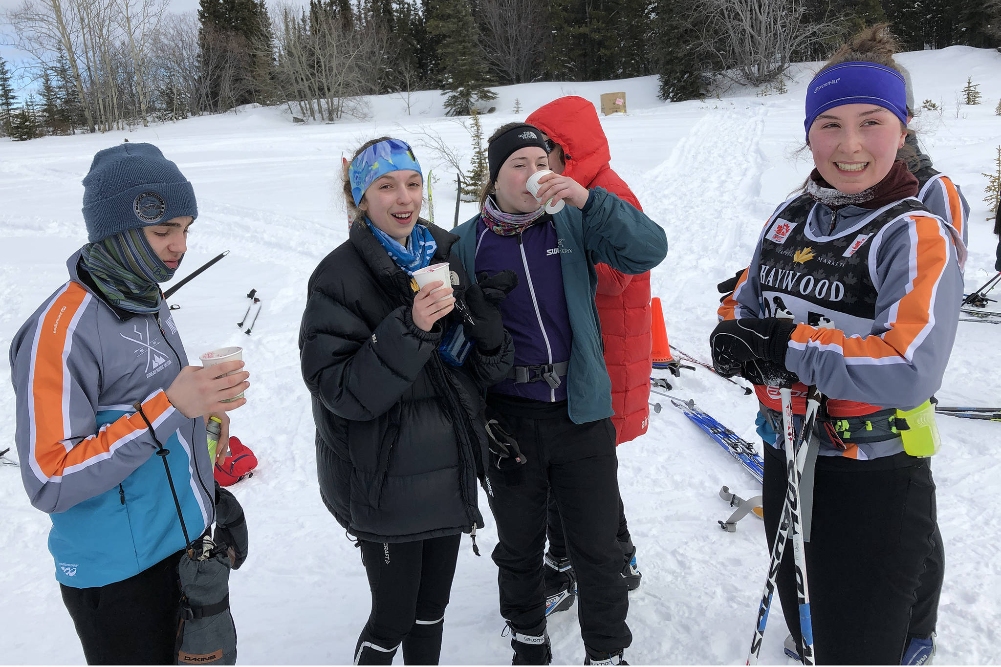 Juneau Nordic Ski Team’s Callahan Croteau, Anna Iverson, Eva Goering and Katie McKenna enjoy hot blueberry soup at the Yukon Ski Marathon 22-kilometer finish line in Whitehorse, Yukon, on Saturday, March 2, 2019. Croteau came in first in the junior male division with a time of 1 hours, 52 minutes, 44 seconds. Goering came in fourth in the senior female division with a time of 1:47:10. (Courtesy Photo | Gretchen Harrington)