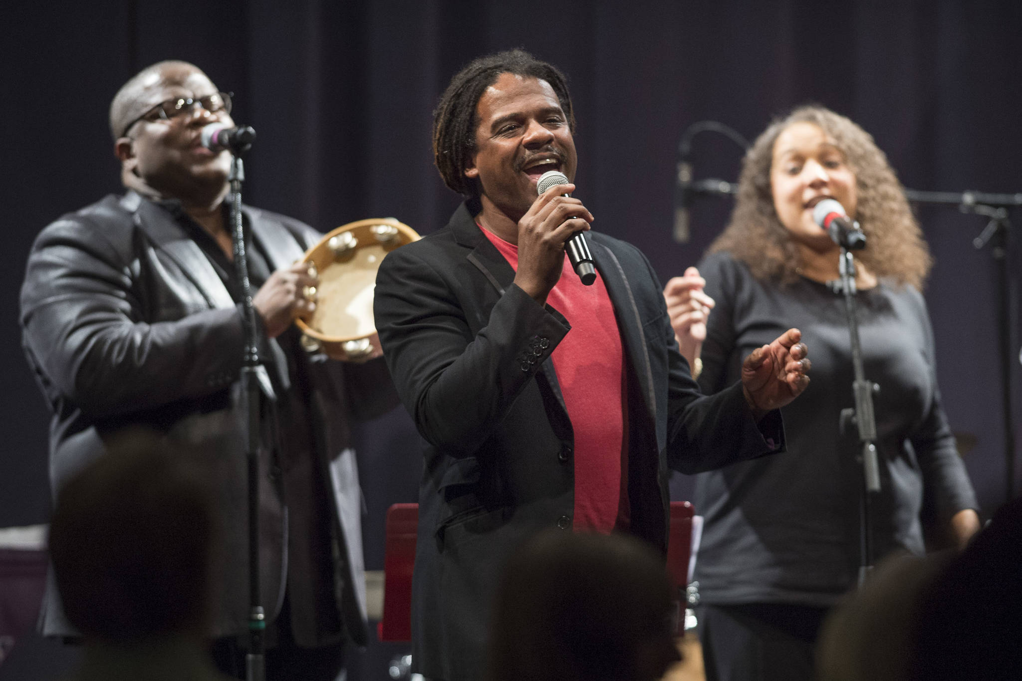 Ryan Shaw, center, sings with Bobby Lewis, left, and Jaunelle Celaire during the performance of “Motown for Our Town” at the Juneau Arts & Culture Center on Friday, March 1, 2019. (Michael Penn | Juneau Empire)