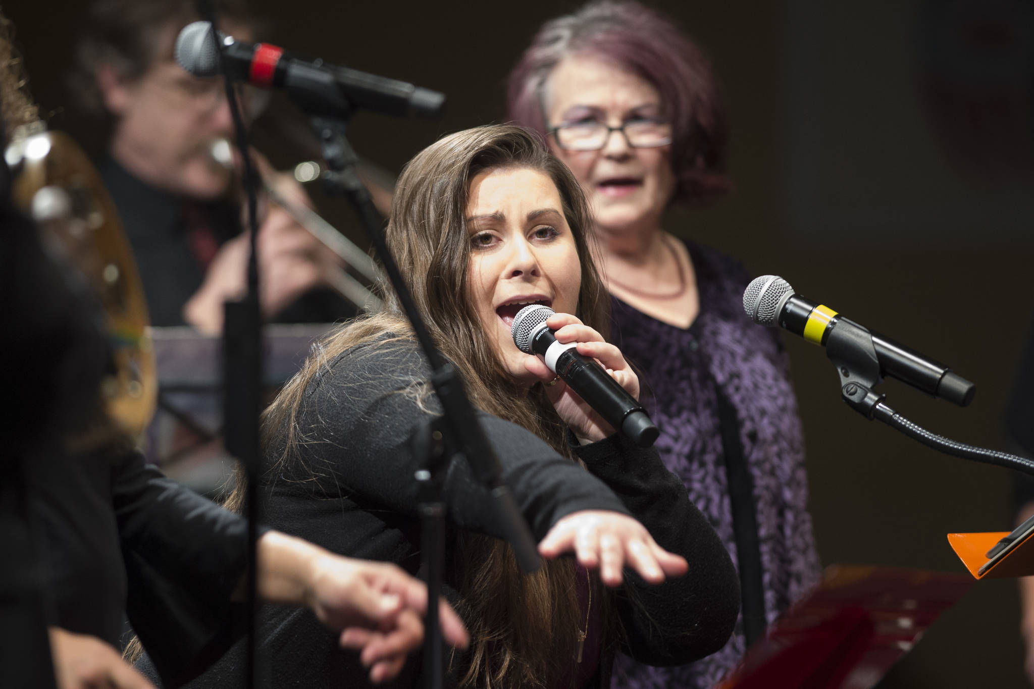 Alyssa Fischer, center, sings during a performance of “Motown for Our Town” featuring Ryan Shaw, Bobby Lewis, Eustace Johnson, Jaunelle Celaire others at the Juneau Arts & Culture Center on Friday, March 1, 2019. (Michael Penn | Juneau Empire)
