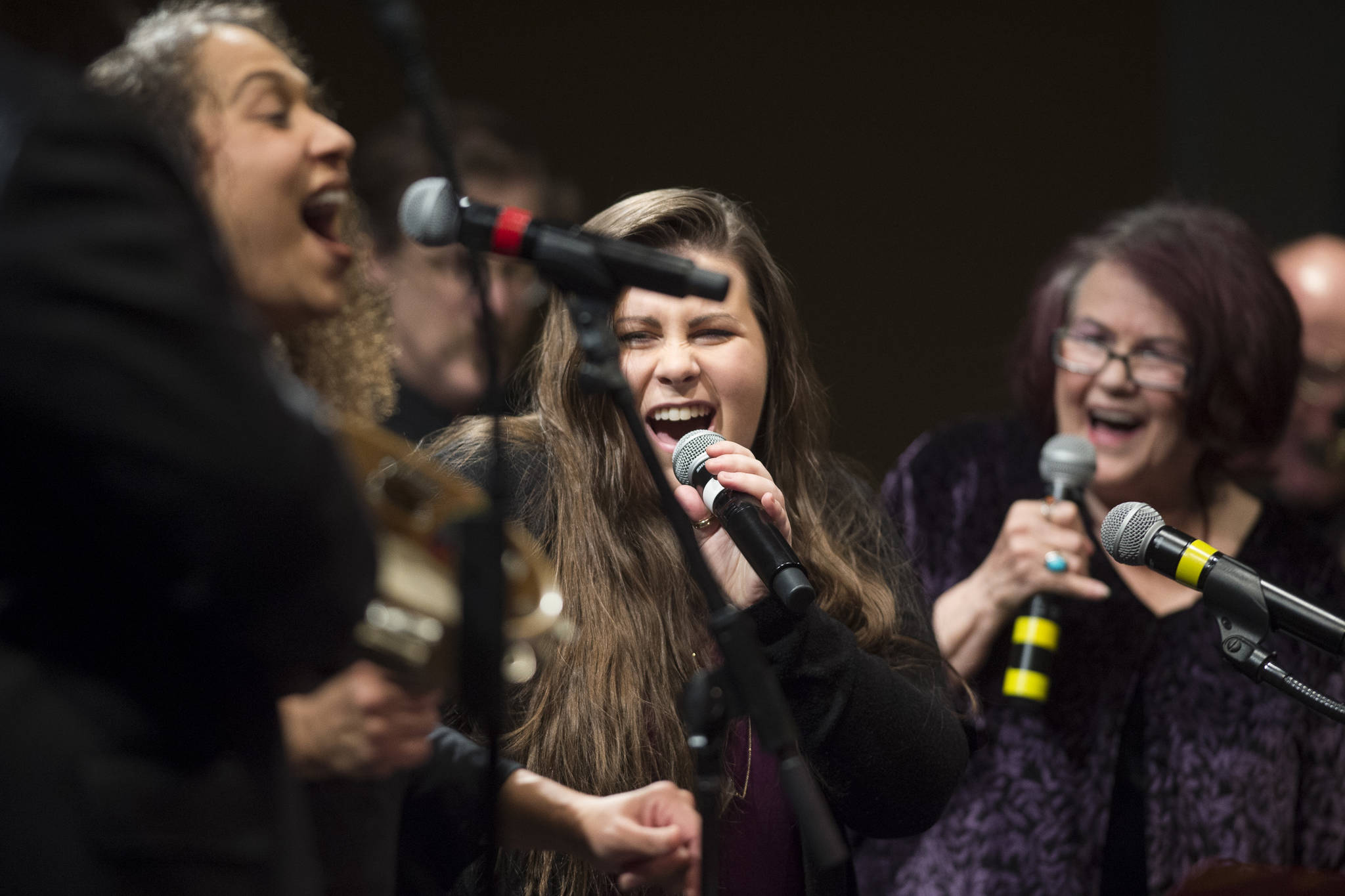 Alyssa Fischer, center, sings during a performance of “Motown for Our Town” featuring Ryan Shaw, Bobby Lewis, Eustace Johnson, Jaunelle Celaire others at the Juneau Arts & Culture Center on Friday, March 1, 2019. (Michael Penn | Juneau Empire)