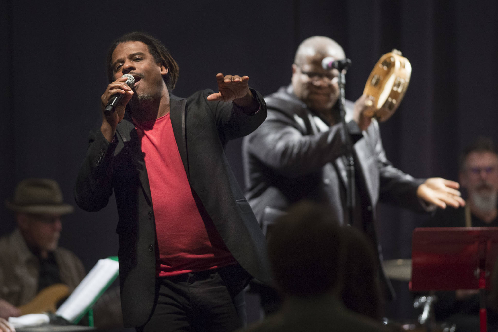 Ryan Shaw, left, sings with Bobby Lewis, during the performance of “Motown for Our Town” at the Juneau Arts & Culture Center on Friday, March 1, 2019. (Michael Penn | Juneau Empire)