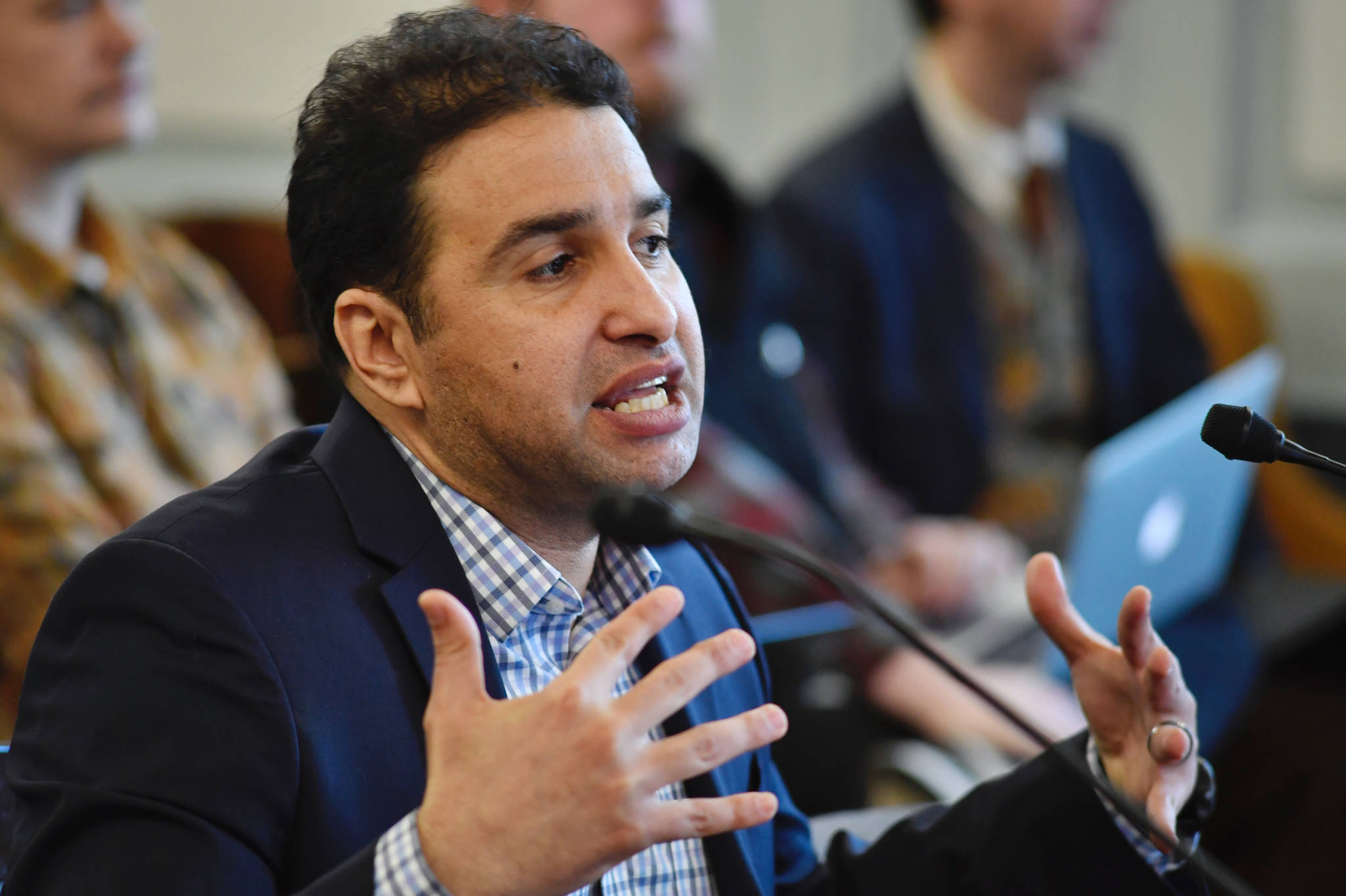 Mouhcine Guettabi, Associate Professor of Economics at the Institute of Social and Economic Research at the University of Alaska Anchorage, speaks to the Senate Finance Committee at the Capitol on Thursday, March 7, 2019. (Michael Penn | Juneau Empire)