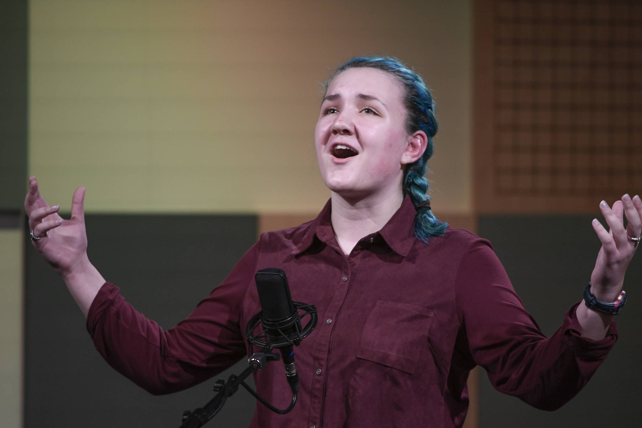 Iris Downey of Homer HIgh School recites one of her three poems at the annual Poetry Out Loud State Championships held at KTOO’s @360 Studio on Thursday, March 7, 2019. (Michael Penn | Juneau Empire)