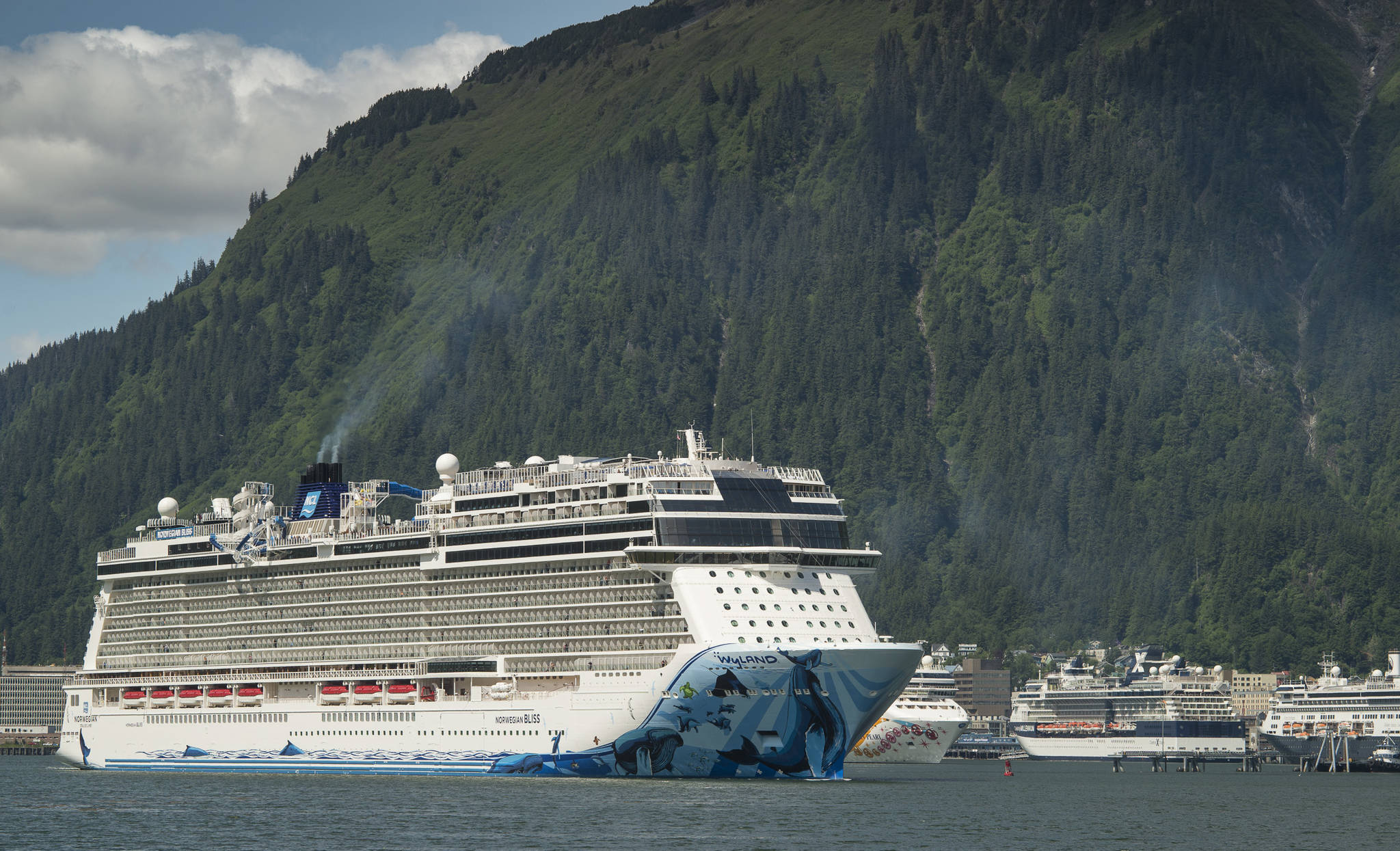 In this June 12, 2018 photo, the Norwegian Bliss pulls out of Juneau’s downtown harbor. (Michael Penn | Juneau Empire)