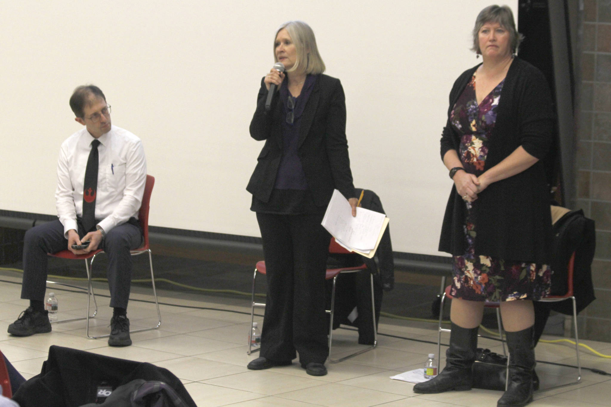 Rep. Andi Story, D-Juneau, speaks while Sen. Jesse Kiehl, left, and Rep. Sara Hannan listen at a town hall meeting on Tuesday at Juneau-Douglas High School. (Alex McCarthy | Juneau Empire)