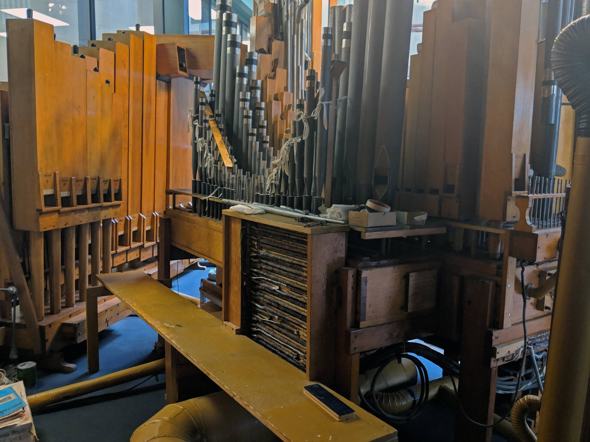 The view from inside the glass display that houses the Kimball pipe organ’s pipes show the engineering that went into the 20th century instrument. (Ben Hohenstatt | Capital City Weekly)
