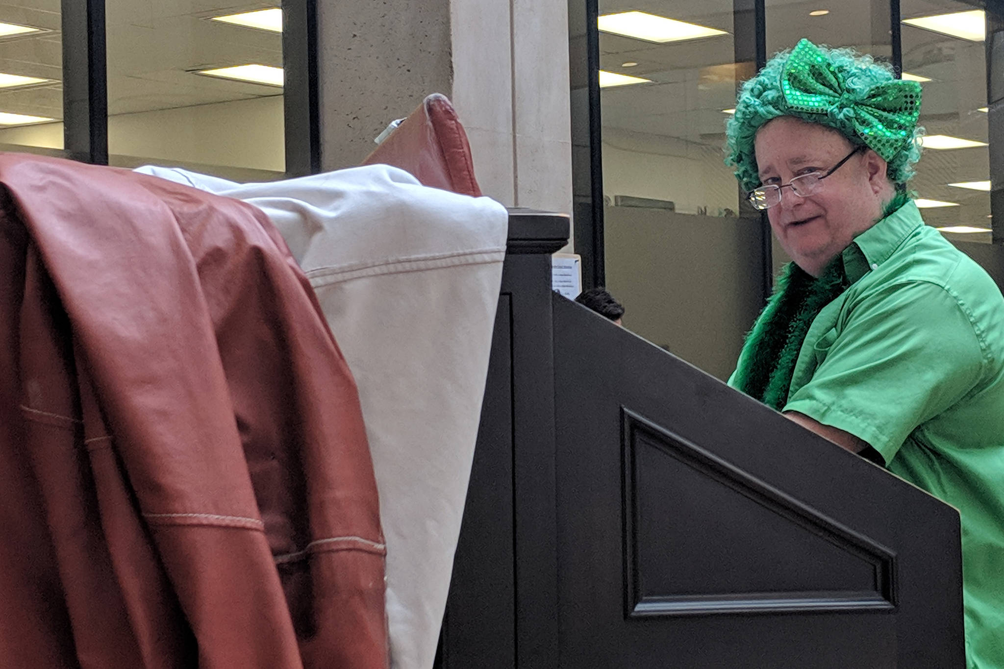 T.J. Duffy dons seasonal garb while playing the 91-year-old Kimball pipe organ Friday, March 15, 2019. (Ben Hohenstatt | Capital City Weekly)