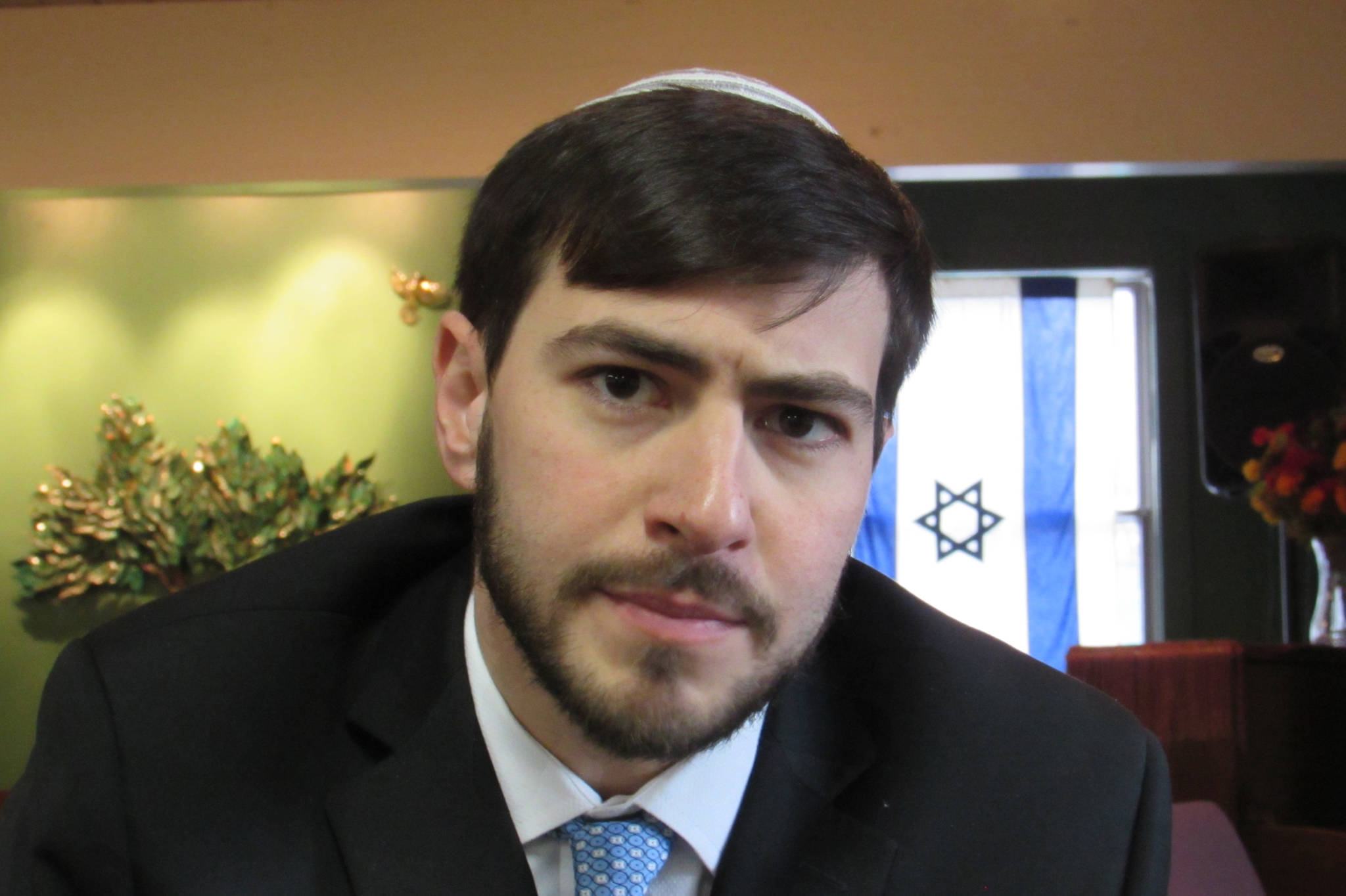 Jeff Dreifus, a rabbinical student from New York who serves as a rabbi for Juneau’s Congregation Sukkat Shalom, talks about the Jewish holiday Purim and its traditions, Friday, March 15, 2019. (Ben Hohenstatt | Juneau Empire)