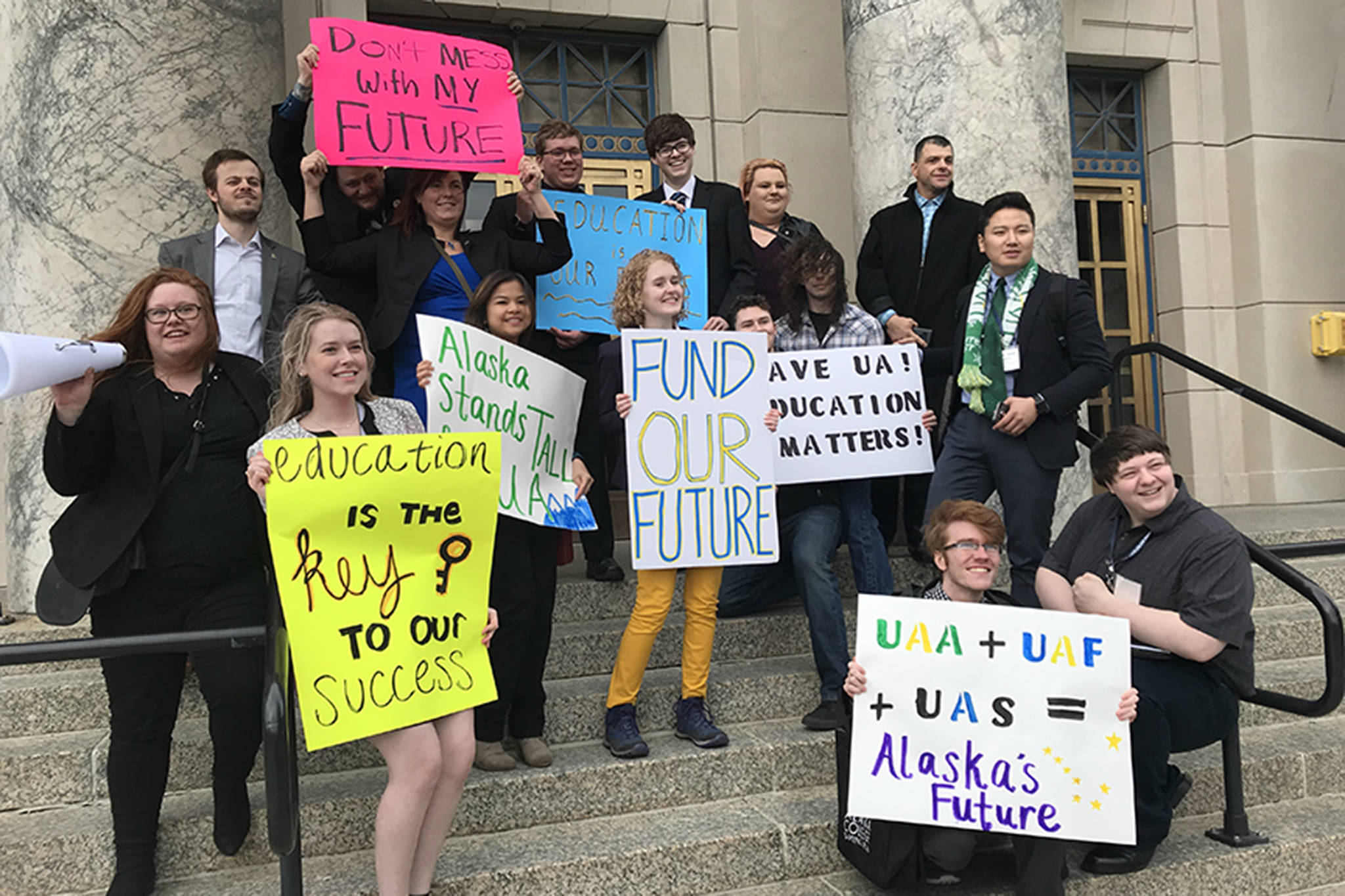 Students from the University of Alaska system pose for a photo after a rally on Monday, March 18, 2019. (Mollie Barnes | Juneau Empire)