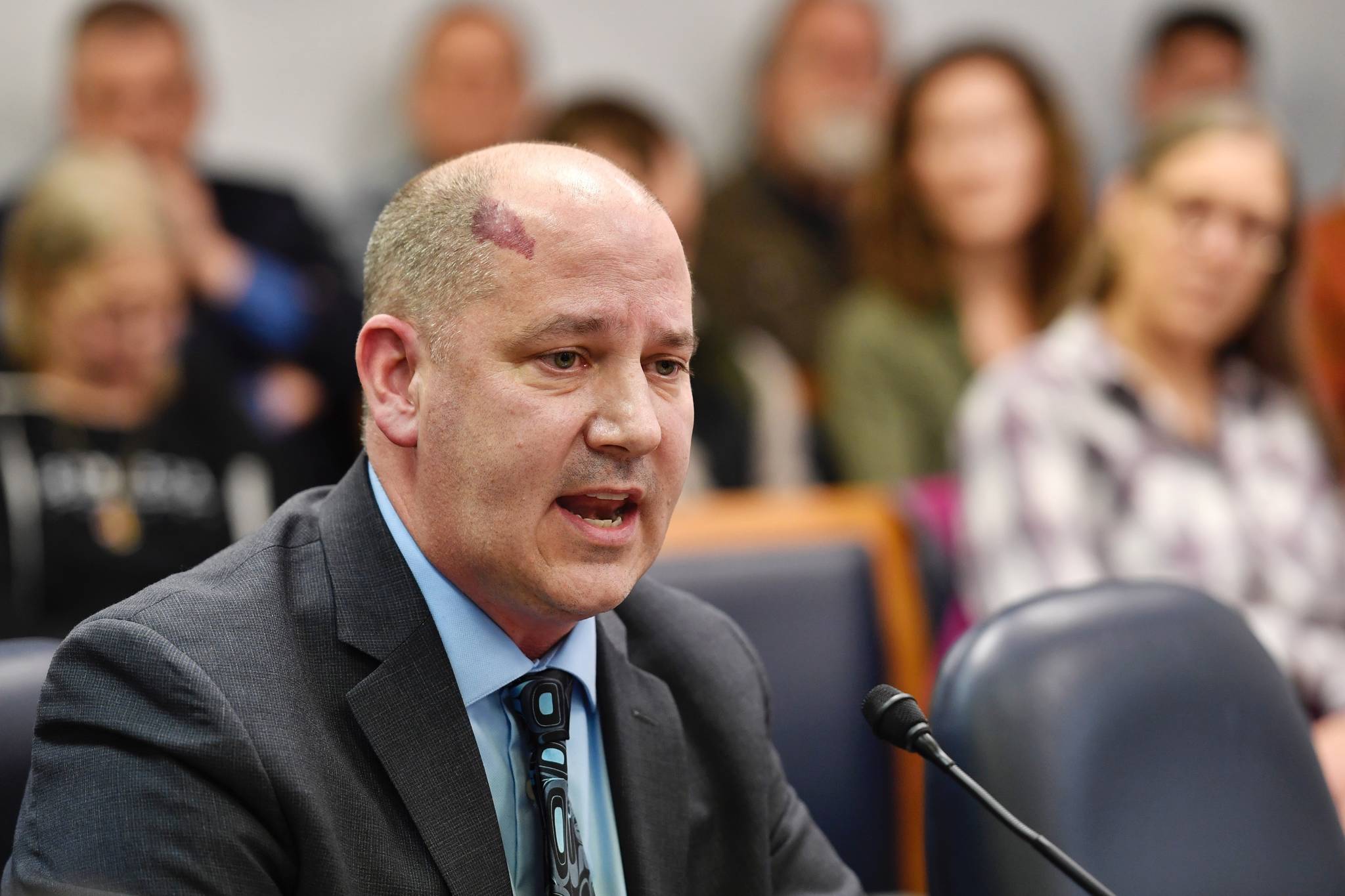 Jason Brune, Commissioner designee for the Department of Environmental Conservation, speaks to the House Resources Committee at the Capitol on Friday, March 14, 2019. (Michael Penn | Juneau Empire)