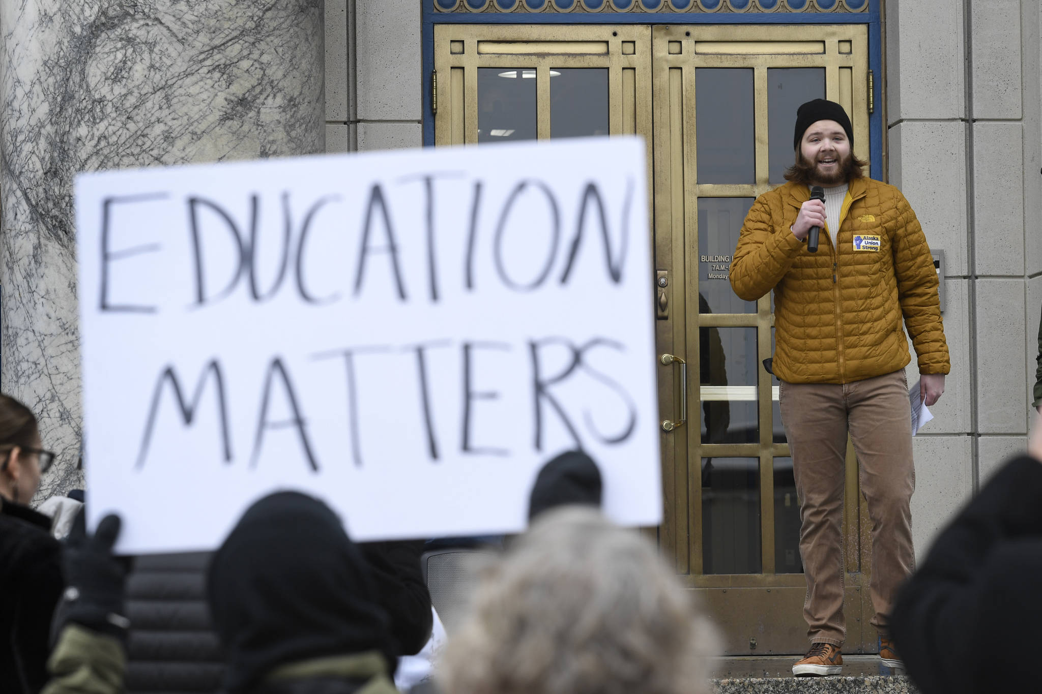 In this Feb. 13, 2019 photo, University of Alaska Southeast Student Body President Nick Bursell speaks at a rally for funding the University of Alaska in front of the Capitol. (Michael Penn | Juneau Empire File)