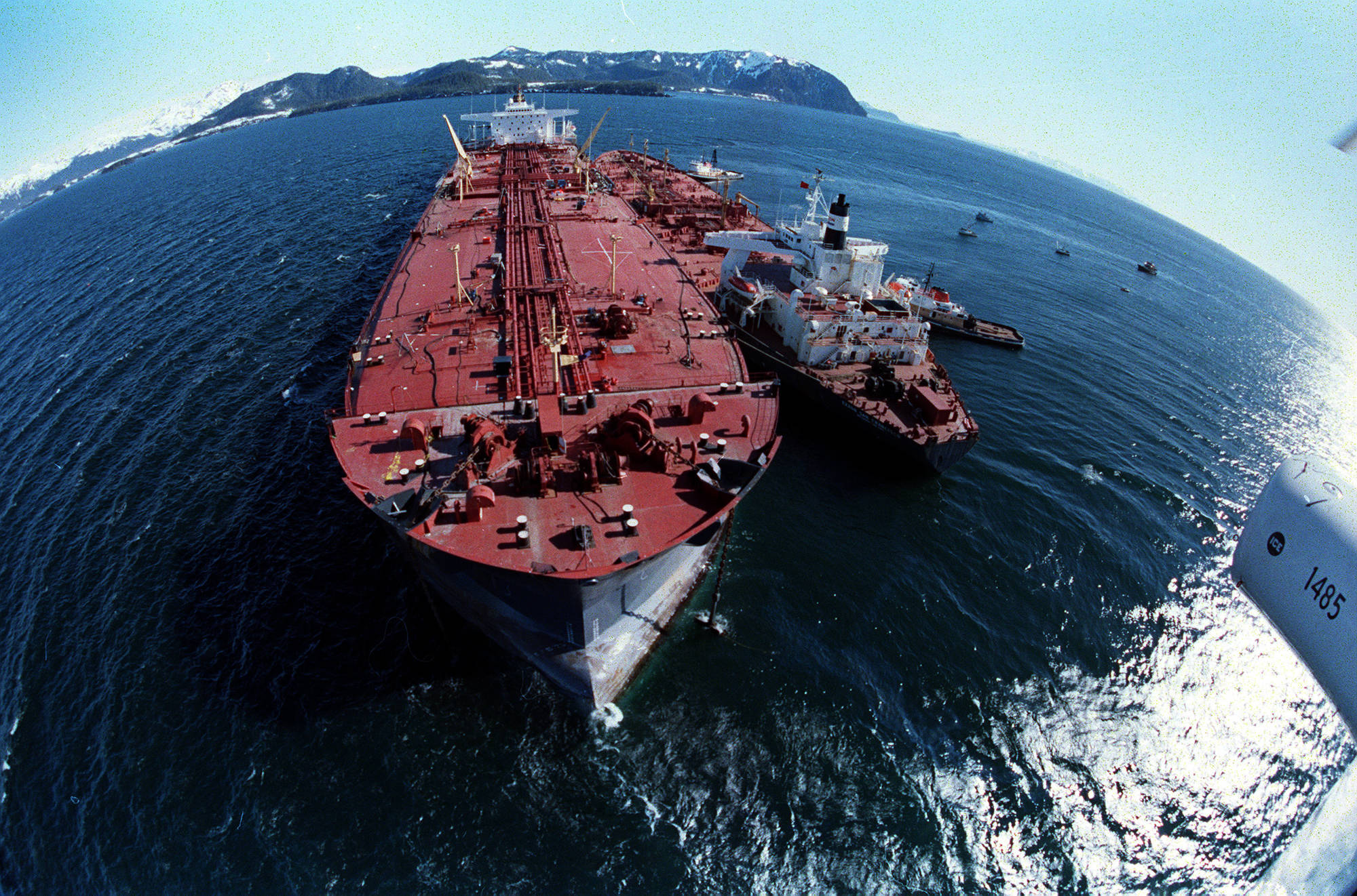In this April 4, 1989 photo, the grounded tanker Exxon Valdez, left, unloads oil onto a smaller tanker, San Francisco, as efforts to refloat the ship continue on Prince William Sound. The Exxon Valdez tanker struck Alaska’s Bligh Reef on March 24, 1989, while bound for California. It spilled about 11 million gallons of crude oil, which storms and currents smeared across about 1,300 miles of shoreline. (Rob Stapleton | Associated Press File)