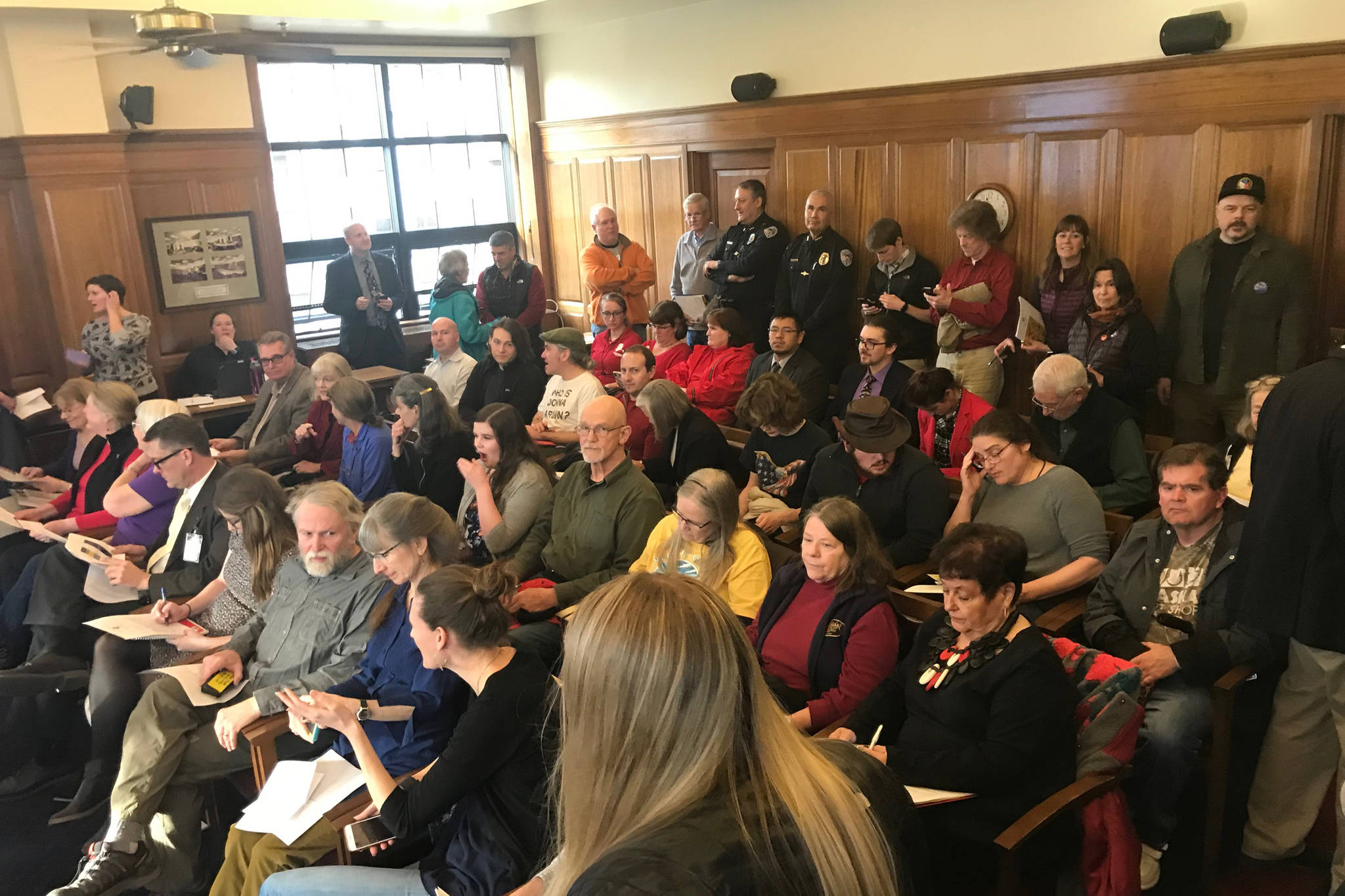 Members of the public wait to share their thoughts on the governor’s budget to the House Finance Committee at the Alaska State Capitol on Friday, March 22, 2019. (Alex McCarthy | Juneau Empire)