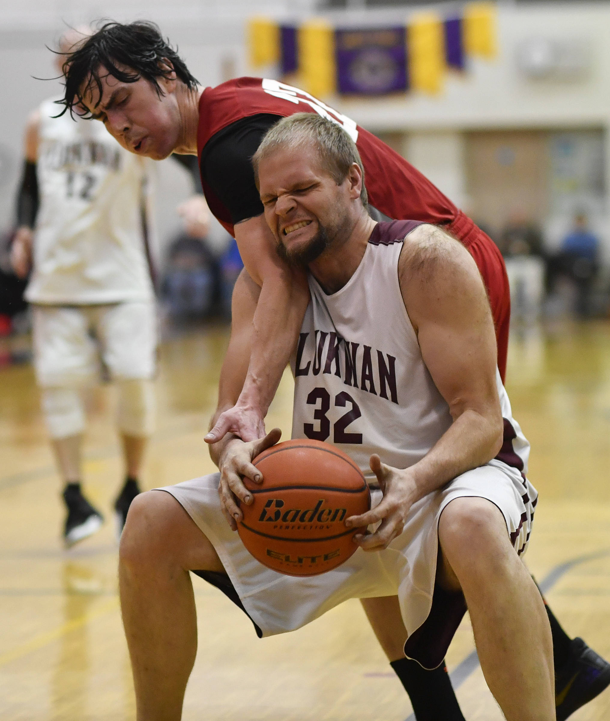 Hoonah’s Donald Dybdahl, left, attempts to get the ball from Klukwan’s Coleman Stanford during their C bracket game at the Juneau Lions Club 73rd Annual Gold Medal Basketball Tournament at Juneau-Douglas High School on Friday, March 22, 2019. Klukwan won 88-67. (Michael Penn | Juneau Empire)