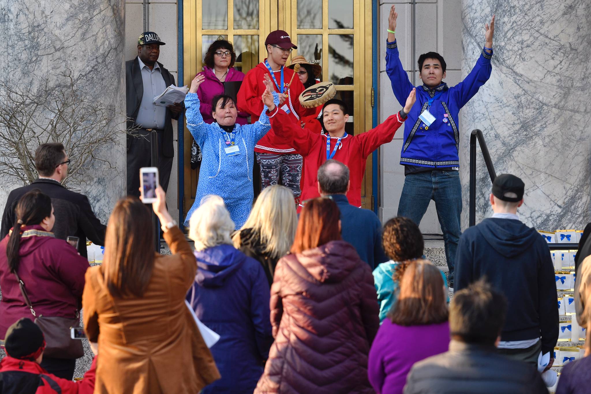 Wilton Charles, 19, of Toksook Bay, drums as advocates from the Alaska chapter of the American Foundation for Suicide Prevention perform a prayer dance at a candlelight vigil on the steps of the Capitol to raise awareness on Tuesday, March 26, 2019. The event was hosted by the AFSP Alaska Chapter, the Alaska Statewide Suicide Prevention Council and the Juneau Suicide Prevention Council. (Michael Penn | Juneau Empire)
