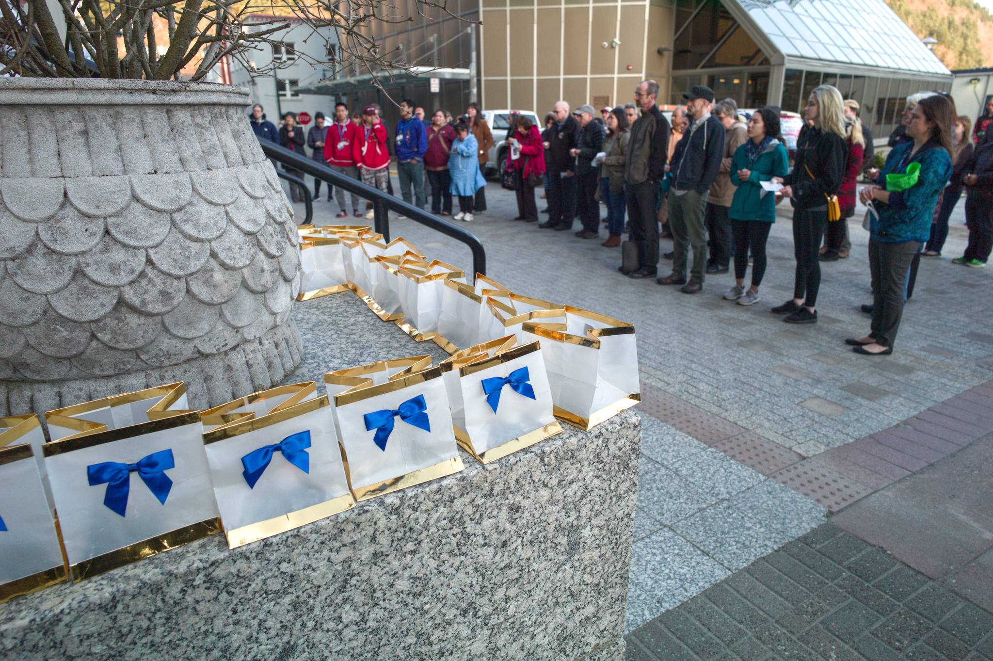 Two hundred bags with electric candles decorate a candlelight vigil on the steps of the Capitol to raise awareness for suicide prevention on Tuesday, March 26, 2019. The decorated bags represent the 200 suicide death in Alaska in 2017. The event was hosted by the AFSP Alaska Chapter, the Alaska Statewide Suicide Prevention Council and the Juneau Suicide Prevention Council. (Michael Penn | Juneau Empire)