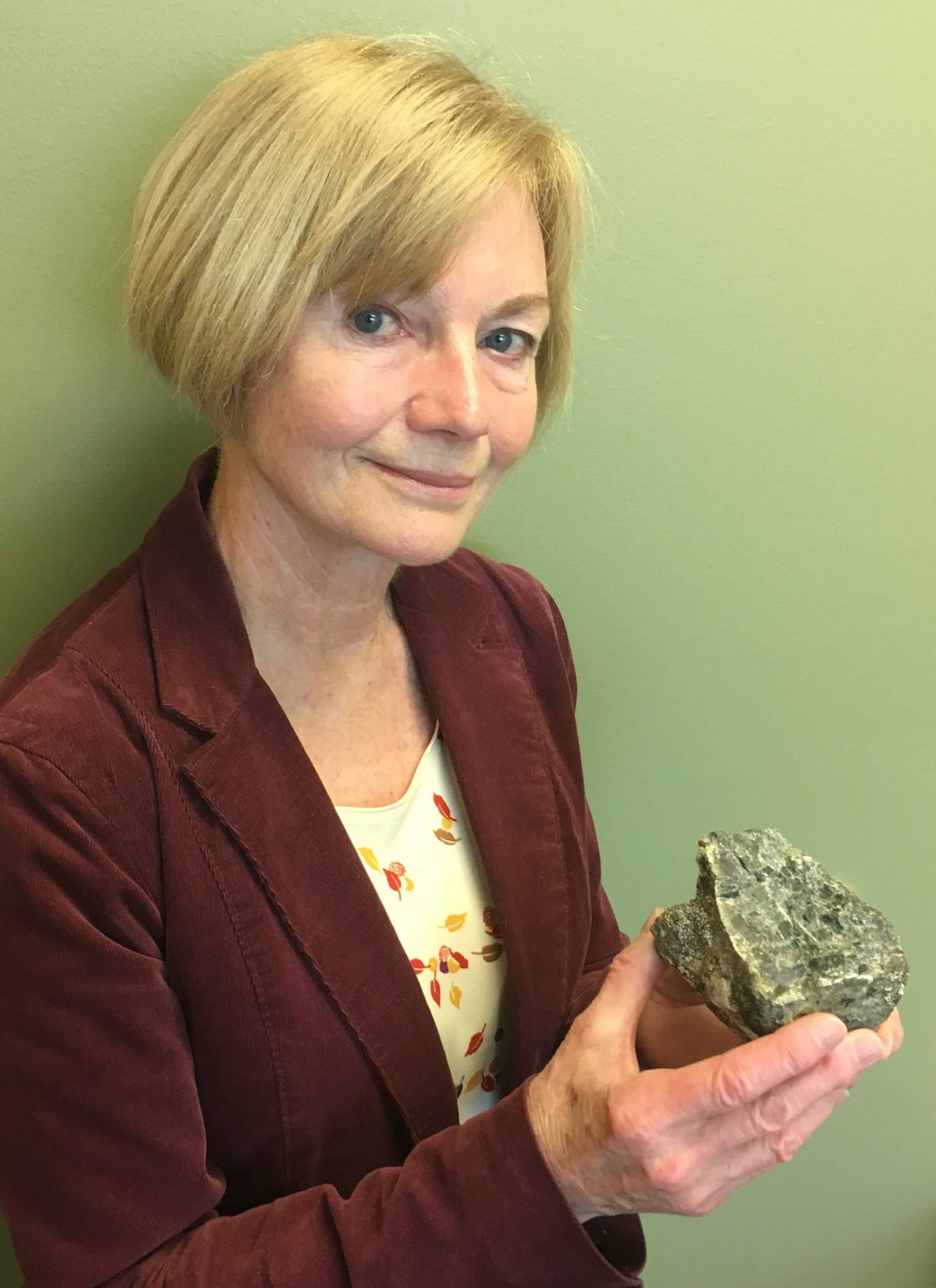 Geologist Marti Miller with a 2 billion-year-old rock she collected near Iditarod. (Courtesy Photo | Adrian Bender)