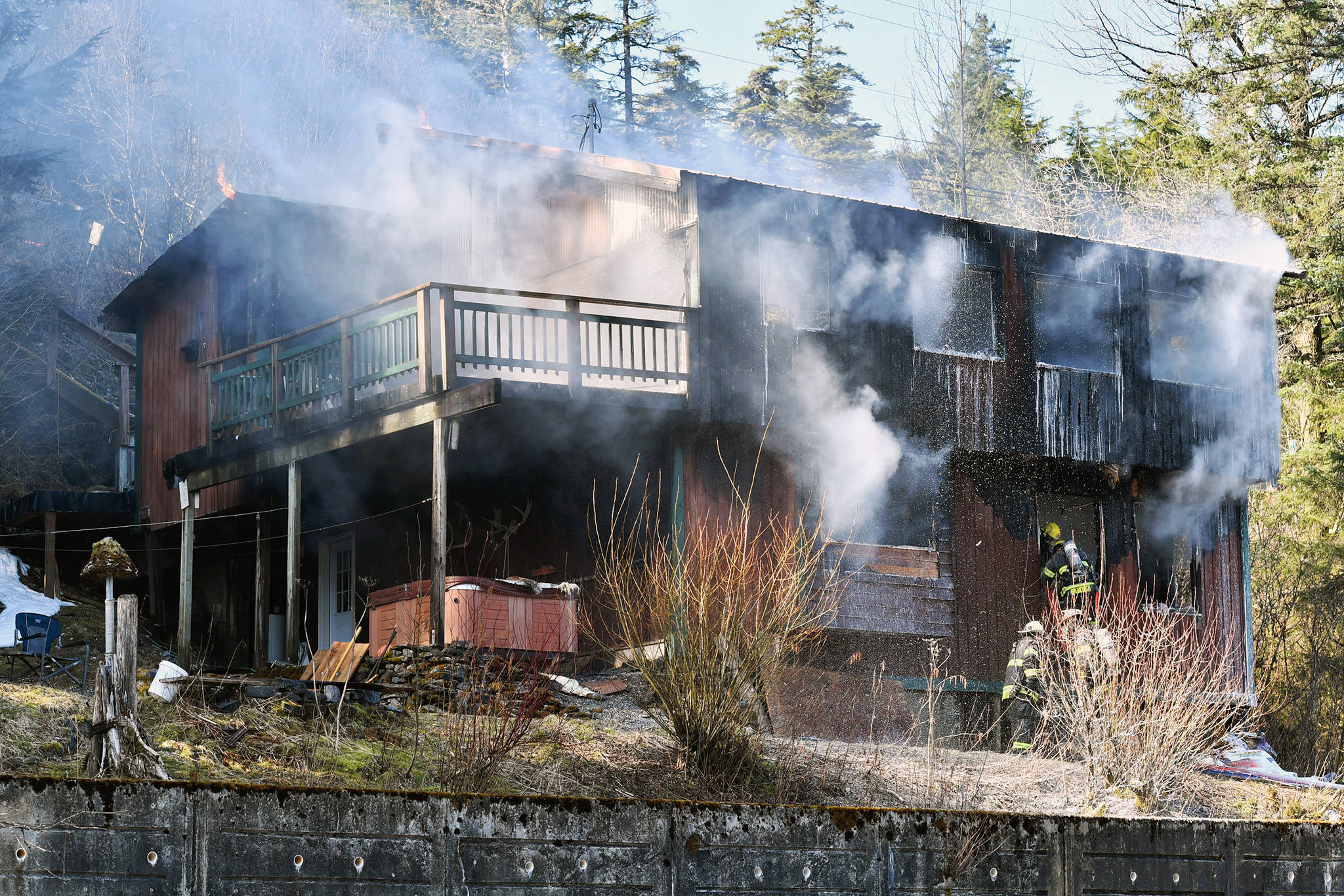 Firefighters knocked down a blaze at this home in the 5600 block of North Douglas Highway on Thursday, March 28, 2019. (Michael Penn | Juneau Empire)