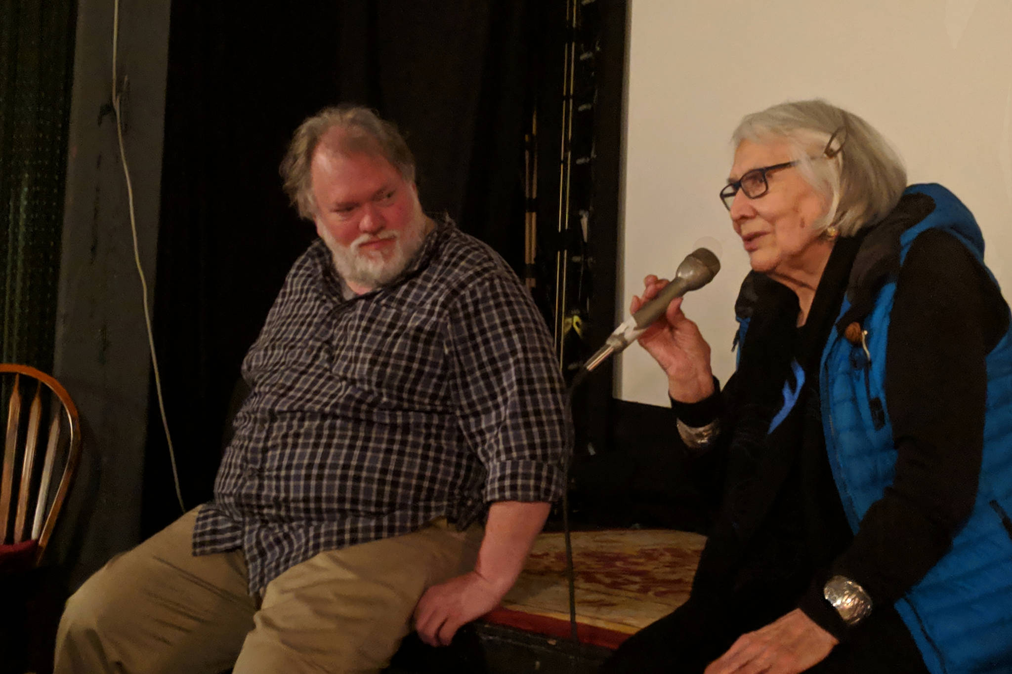 Curator of collections for Alaska State Museums Steve Henrikson and weaver Delores Churchill talk after a screening of “Tracing Roots,” Sunday, March 31, 2019. (Ben Hohenstatt | Capital City Weekly)