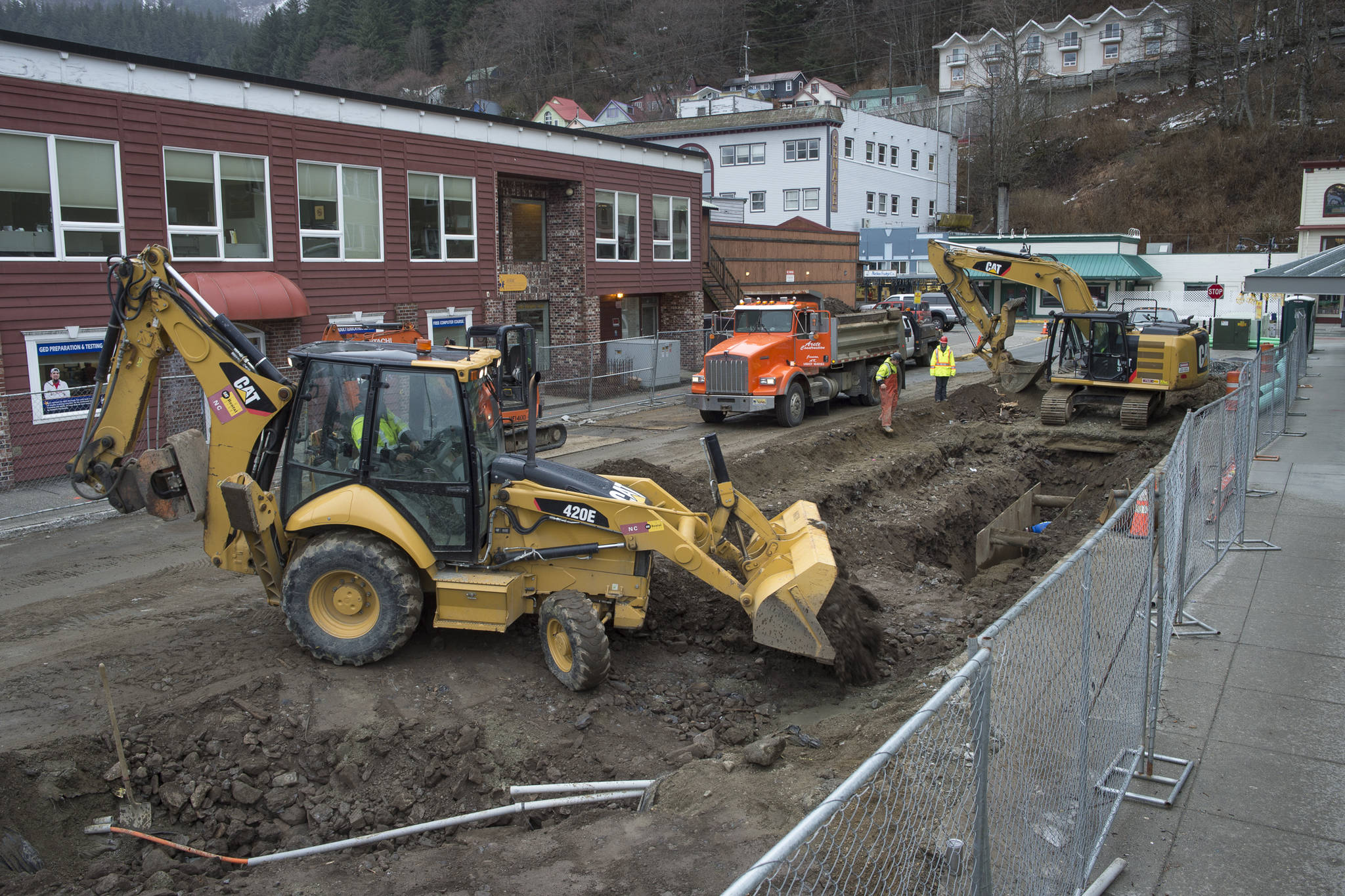 A crew from Arete Construction works on a now closed Ferry Way on Wednesday, March 13, 2019. The construction is phase three in the downtown street and sidewalk remodel and is expected to be completed by early May. (Michael Penn | Juneau Empire)