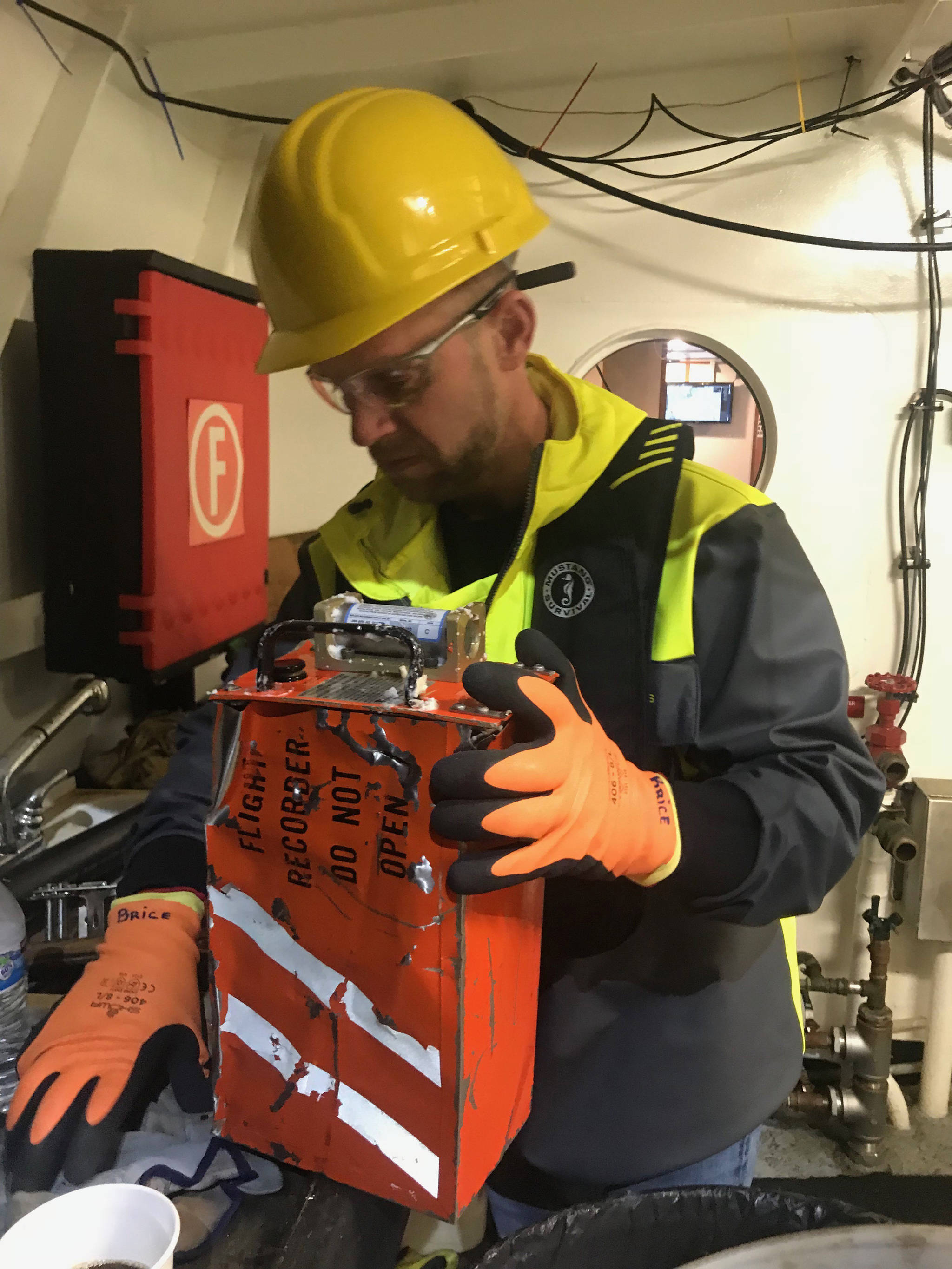 NTSB investigator Brice Banning holds a flight recorder from a Beechcraft B200 that was recovered from the ocean waters of Fredrick Sound near Kake. Alaska. The airplane crashed on Jan. 29, 2019 while on approach to the Kake Airport. The airplane was being operated by Guardian Flight as an air ambulance flight. (Courtesy Photo | National Transportation Safety Board)