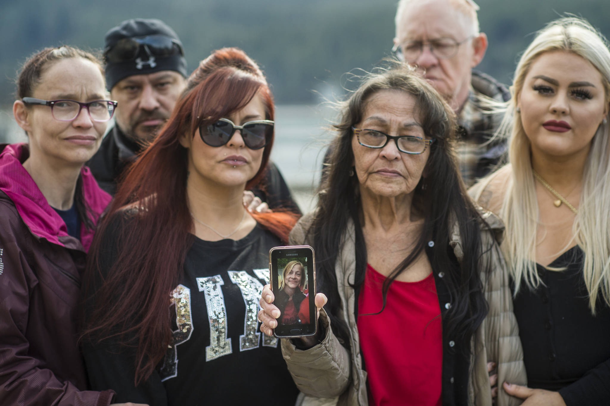Family members of Tracy Day have been looking for her since Feb. 14. From left: Sister Angela Day-Nalan, brother John Day, Jr., sister Crystal Delgado, mother Lilly Day, father John Day, Sr., daughter Kaelyn Schneider. (Michael Penn | Juneau Empire)