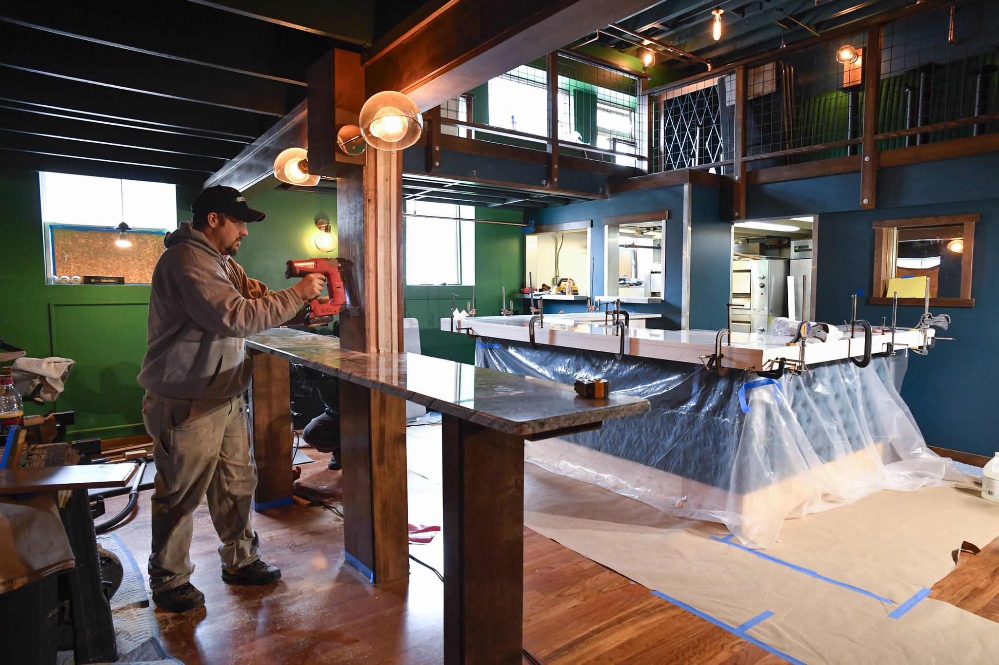 Matt Herrick works on the remodel of Roma (formerly known as Pizzeria Roma) on Friday, April 5, 2019. The restaurant is scheduled to reopen on April 15. (Michael Penn | Juneau Empire)