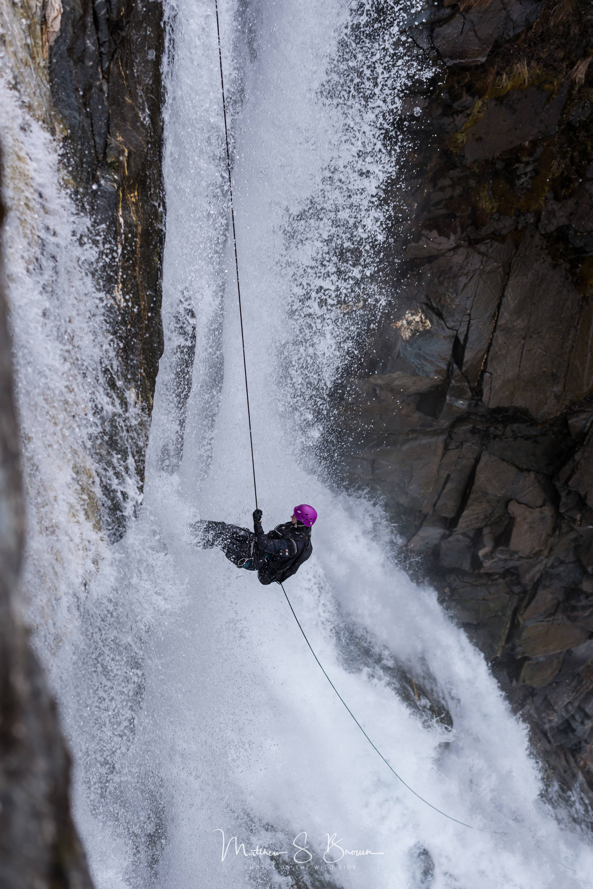 Alice Wanders rappels off Nugget Falls in Juneau on April 6, 2019. (Courtesy Photo | Matthew Brown)