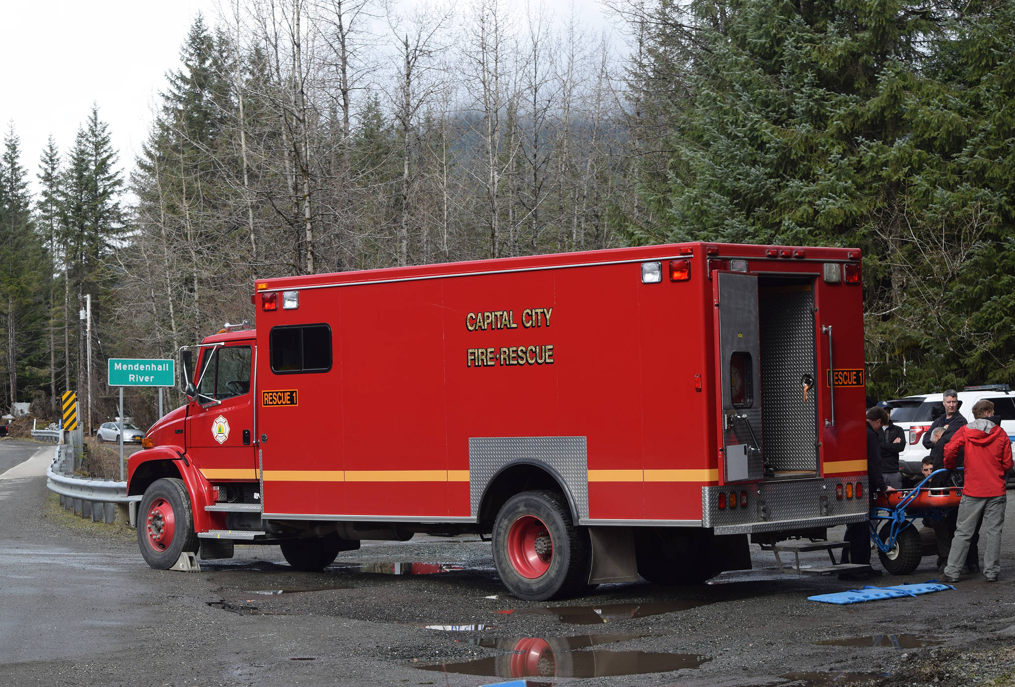 A Capital City Fire/Rescue multi-use rescue vehicle is parked at the Dredge Lake Traihead on Back Loop Road. A body was found Wednesday morning in the Mendenhall River. (Nolin Ainsworth | Juneau Empire)