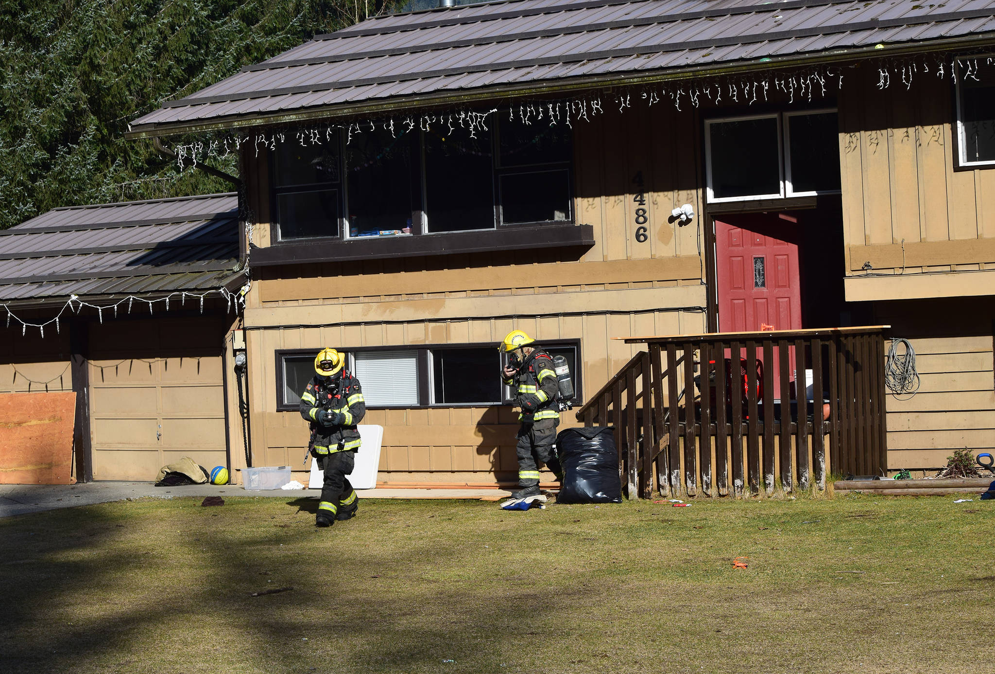 Capital City Fire/Rescue firefighters respond to a house fire on Columbia Boulevard in the Mendenhall Valley on Wednesday, April 10, 2019. (Nolin Ainsworth | Juneau Empire)