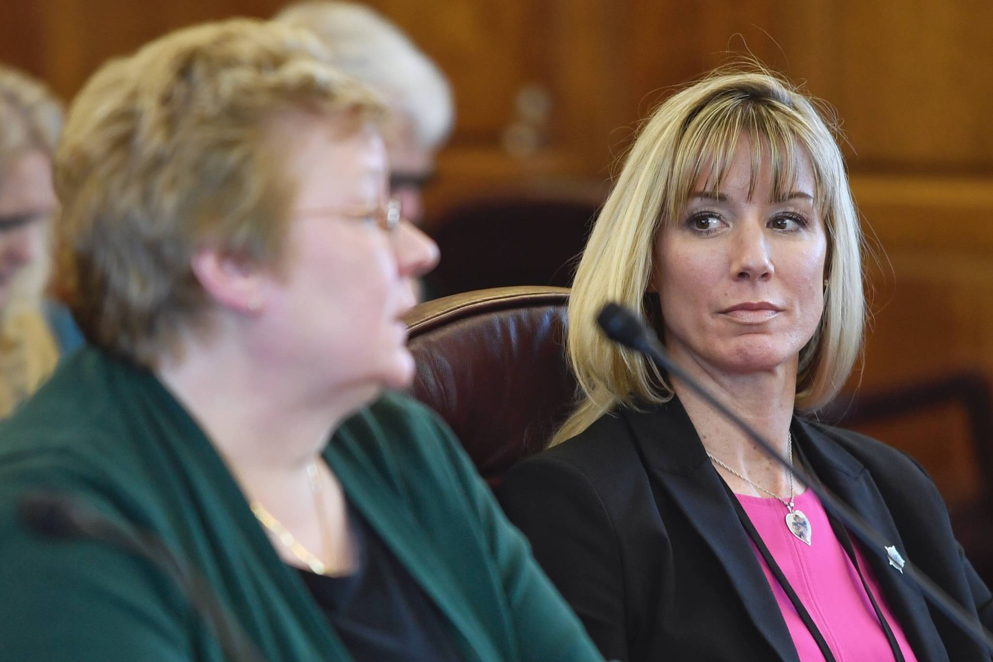 Amanda Price, commissioner of the Department of Public Safety, right, watches as Kathryn Monfreda, bureau chief of the Department of Public Safety’s Division of Statewide Services, presents the Uniform Crime Reporting Annual Report to House members during an informational meeting at the Capitol on Tuesday, Feb. 5, 2019. (Michael Penn | Juneau Empire File)