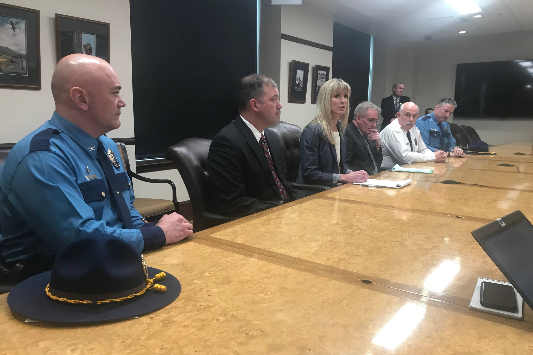 Department of Public Safety Commissioner designee Amanda Price (center) appears with her staff at the Alaska State Capitol on Tuesday, April 16, 2019. (Alex McCarthy | Juneau Empire)