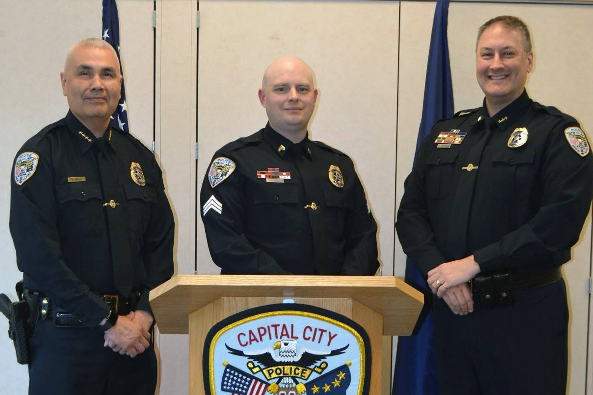 Sgt. Matt Dubois, center, stands with Juneau Police Chief Ed Mercer, left, and Deputy Chief David Campbell, right, during his promotion ceremony on Monday, April 15, 2019. (Courtesy photo | Juneau Police Department Facebook)